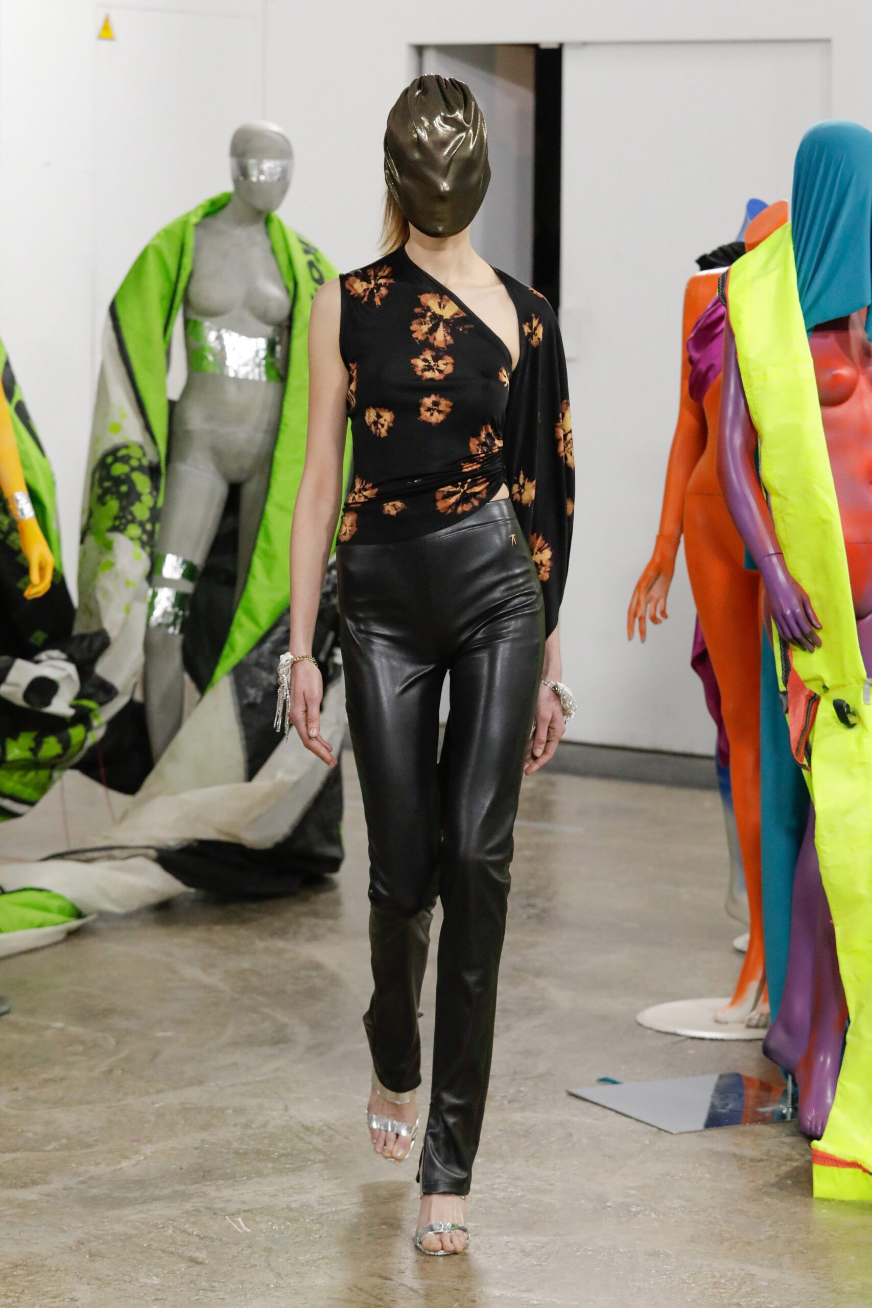 black floral asymmetric top with leather pants