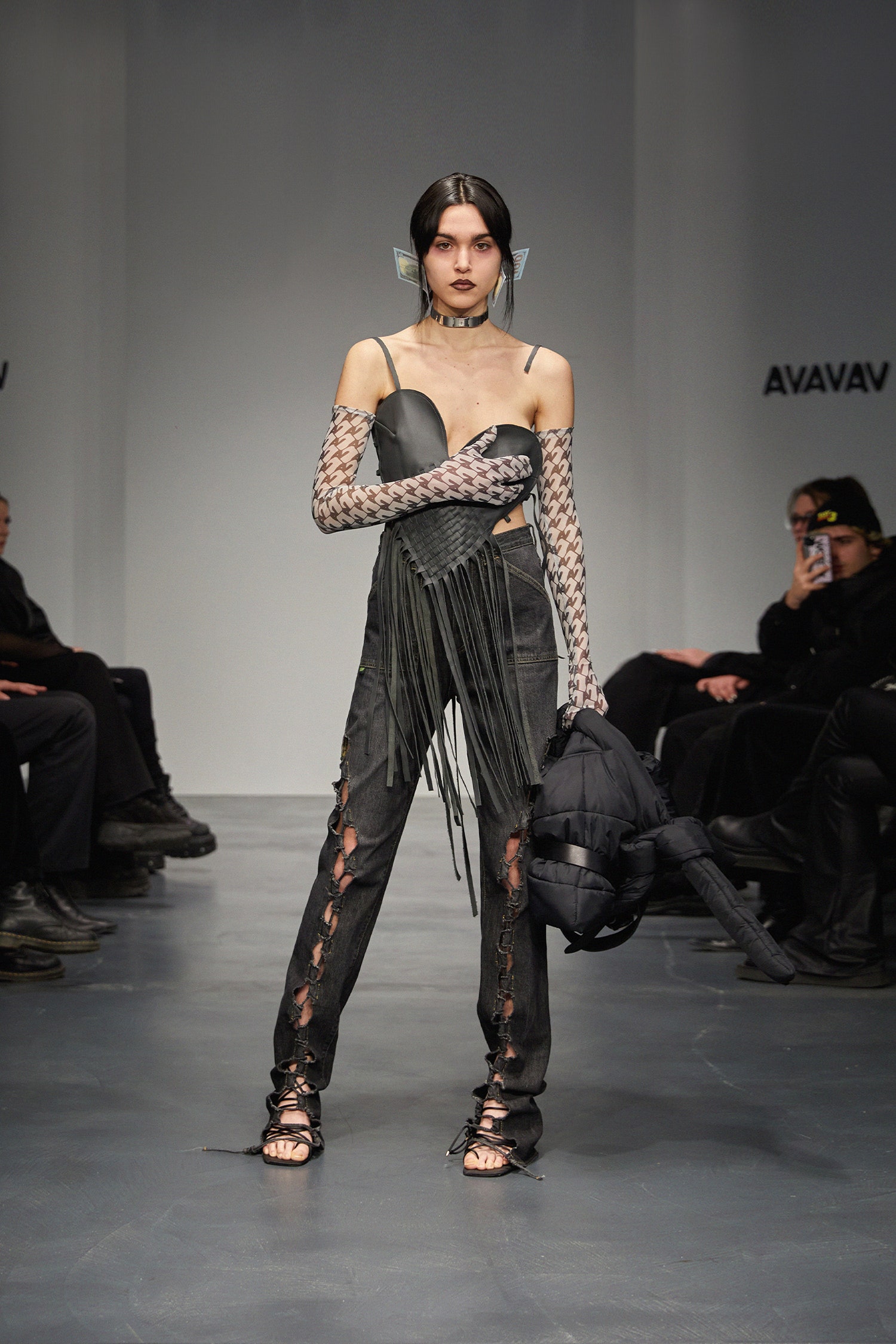 black leather fitted top and distressed pants