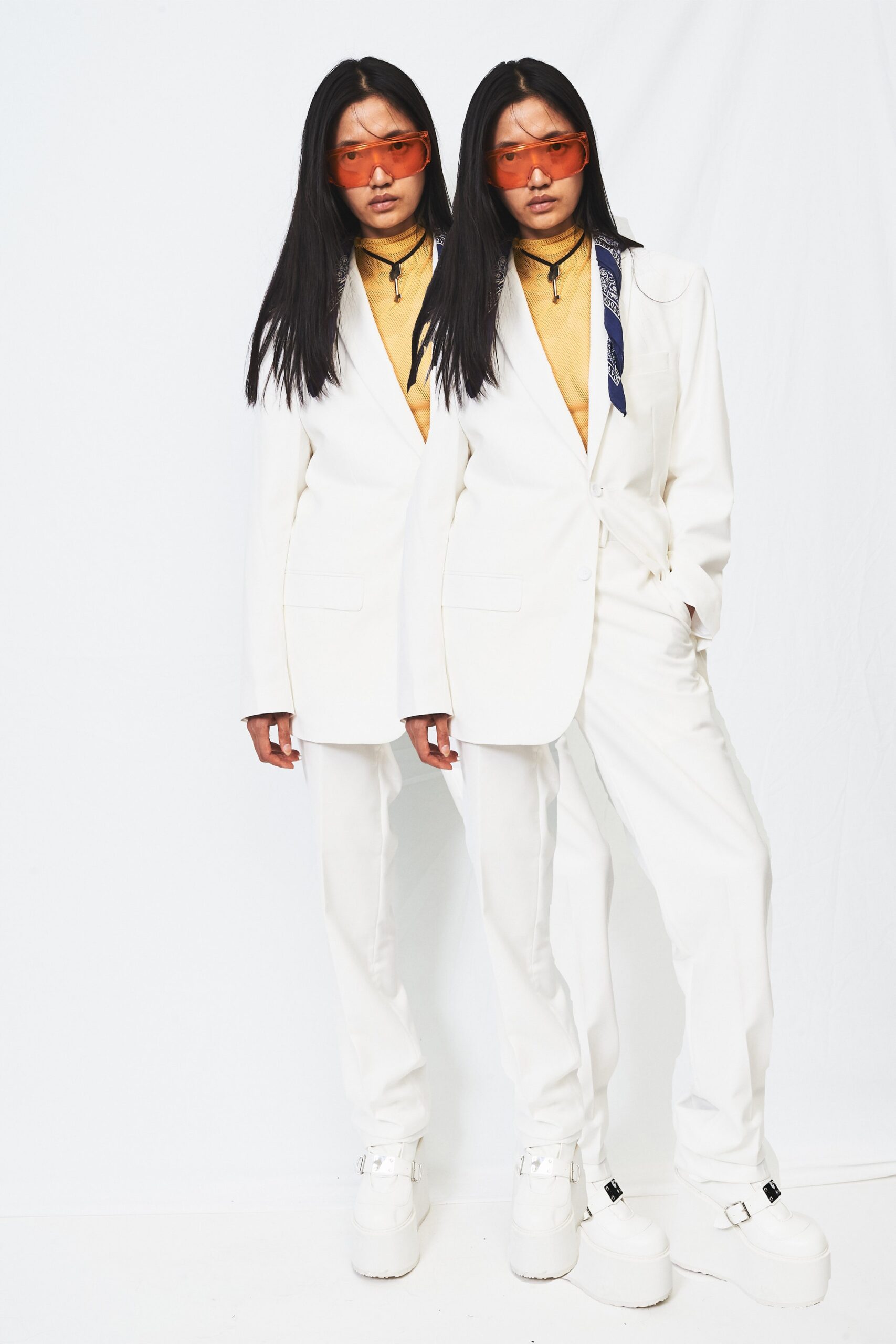 white tailored suit with yellow top