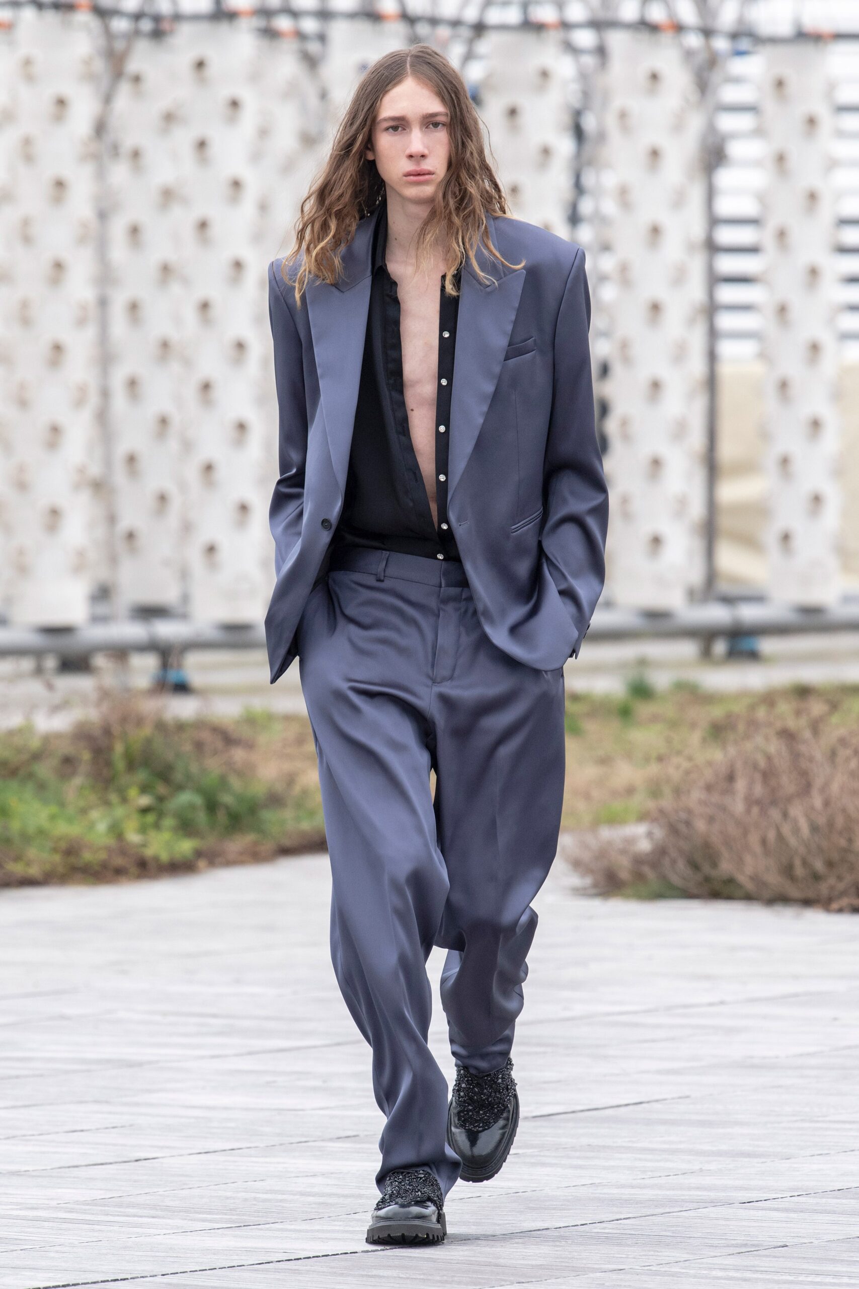 blue tailored suit with black shoes