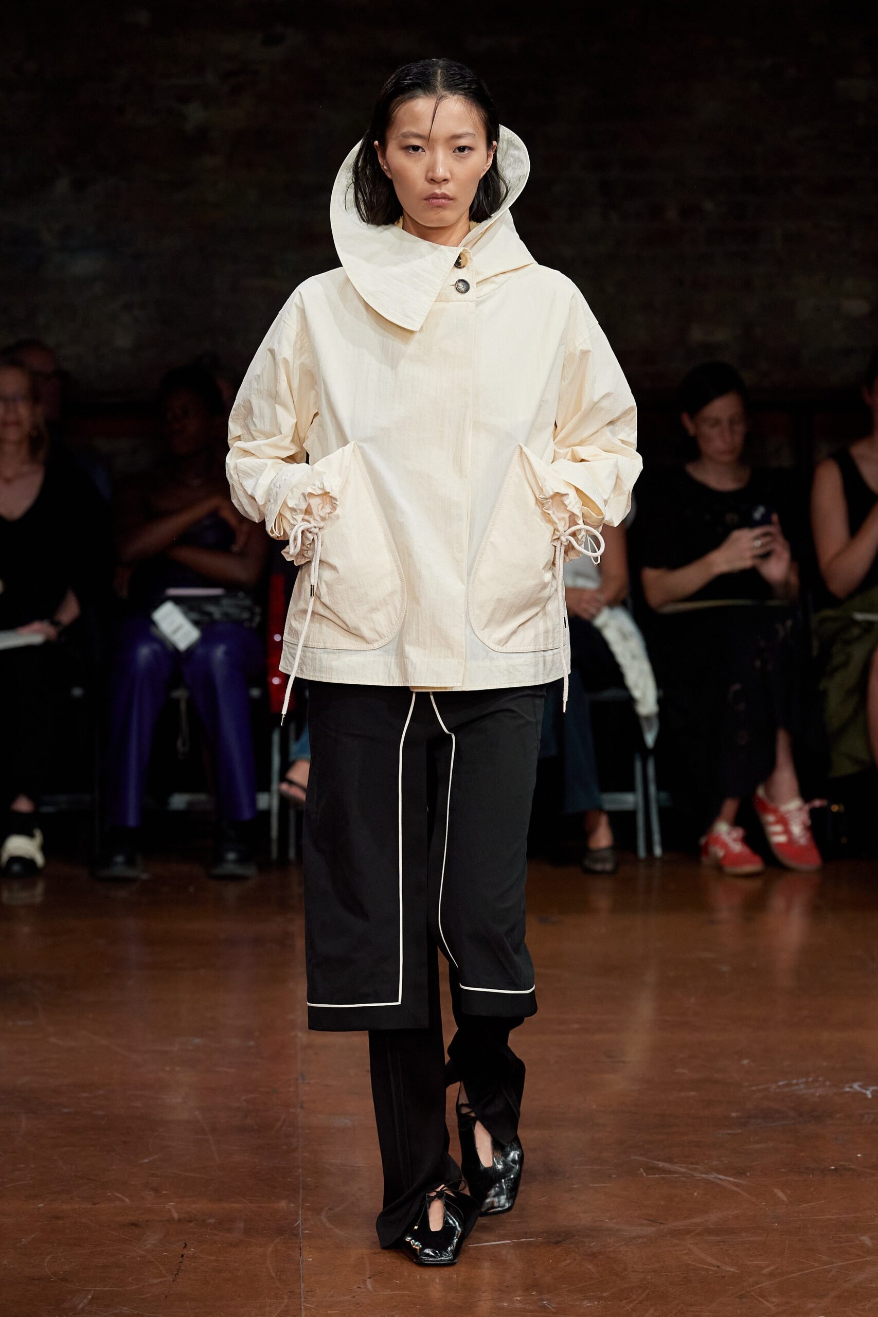 white relaxed hooded jacket and black tailored pants