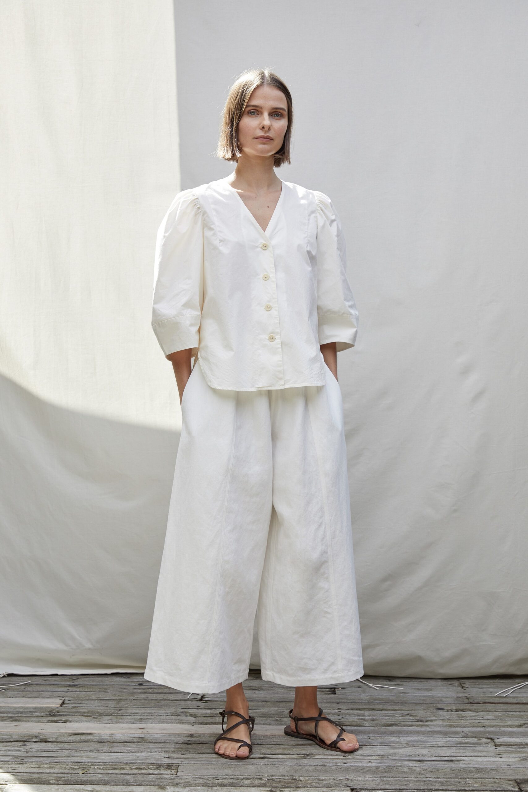 white cotton short-sleeve v-neck relaxed buttoned top