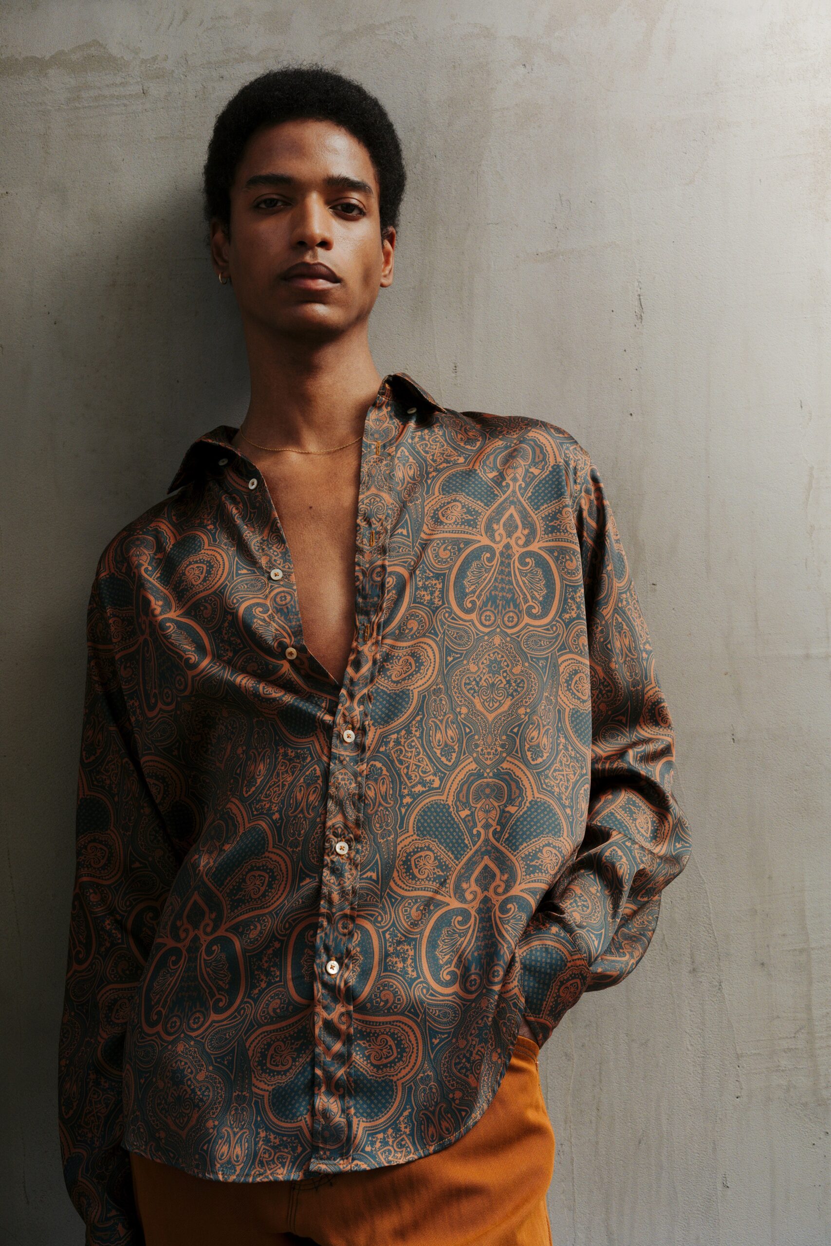 printed silk shirt and orange pants