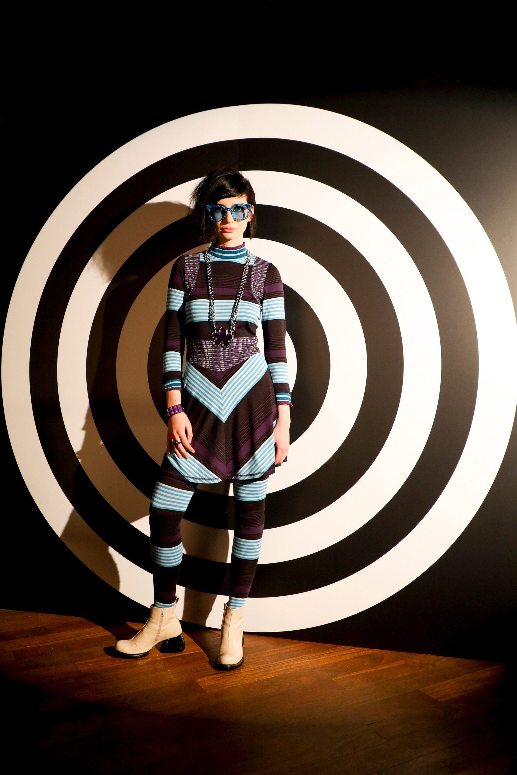 fitted black and blue striped catsuit