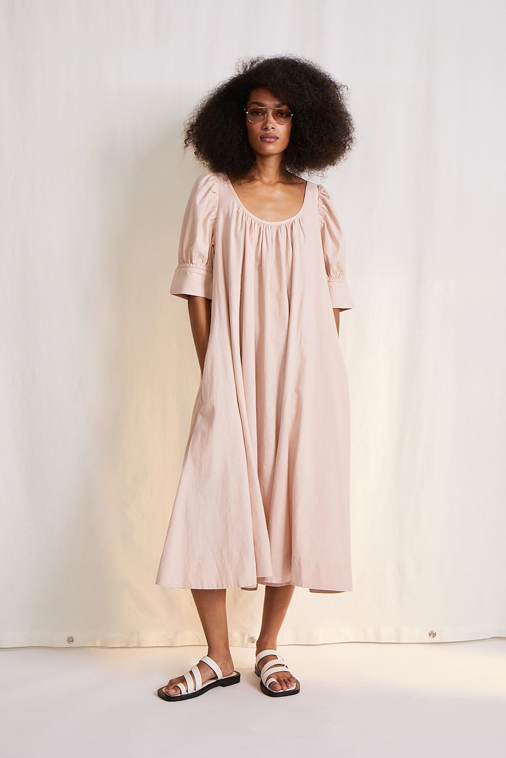 pink relaxed midi dress with white shoes