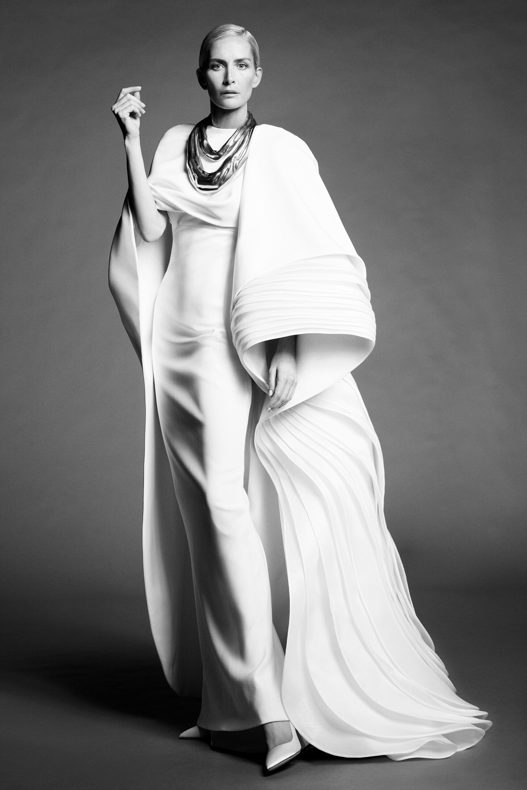 white silk fitted gown with cape