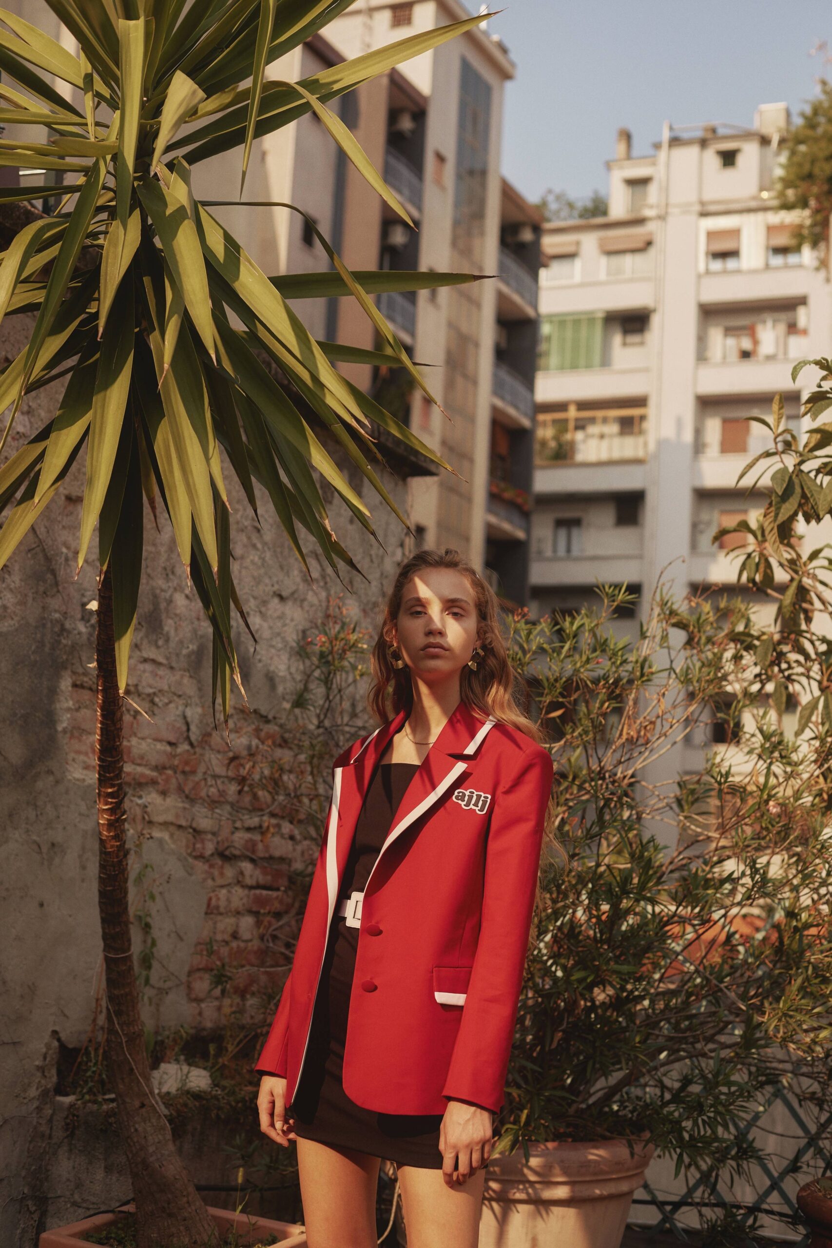 red fitted blazer with black mini-dress