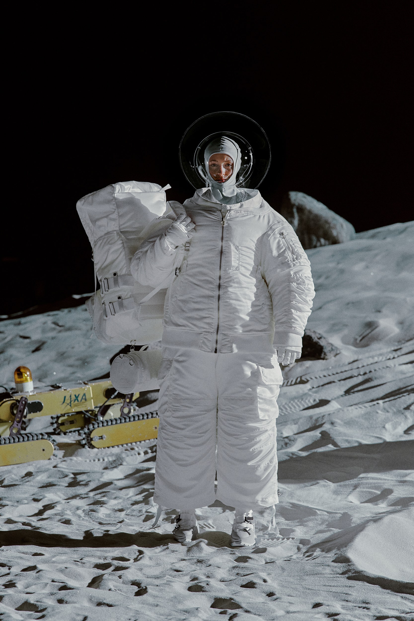 white vinyl jumpsuit and boots
