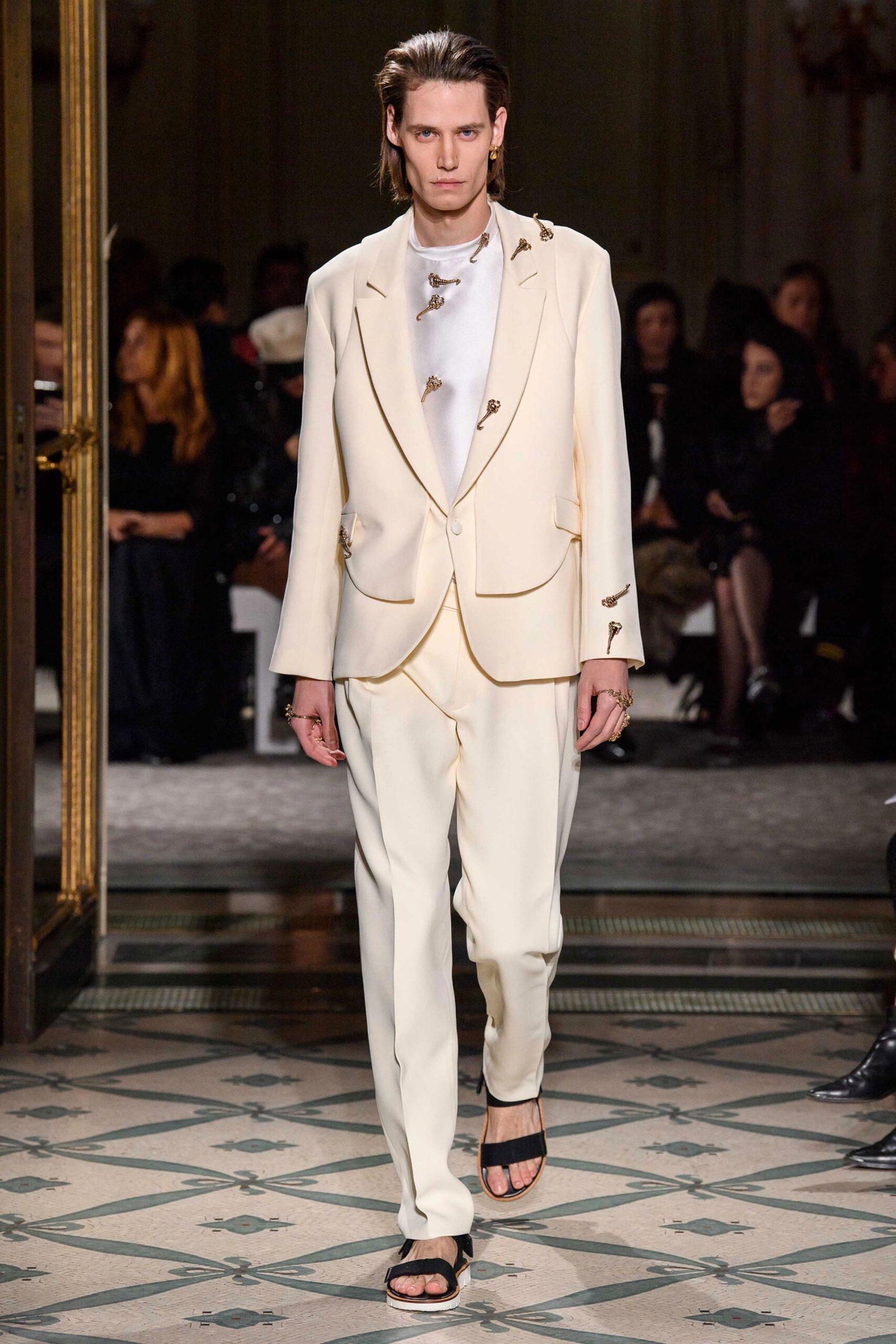 white tailored suit with black shoes