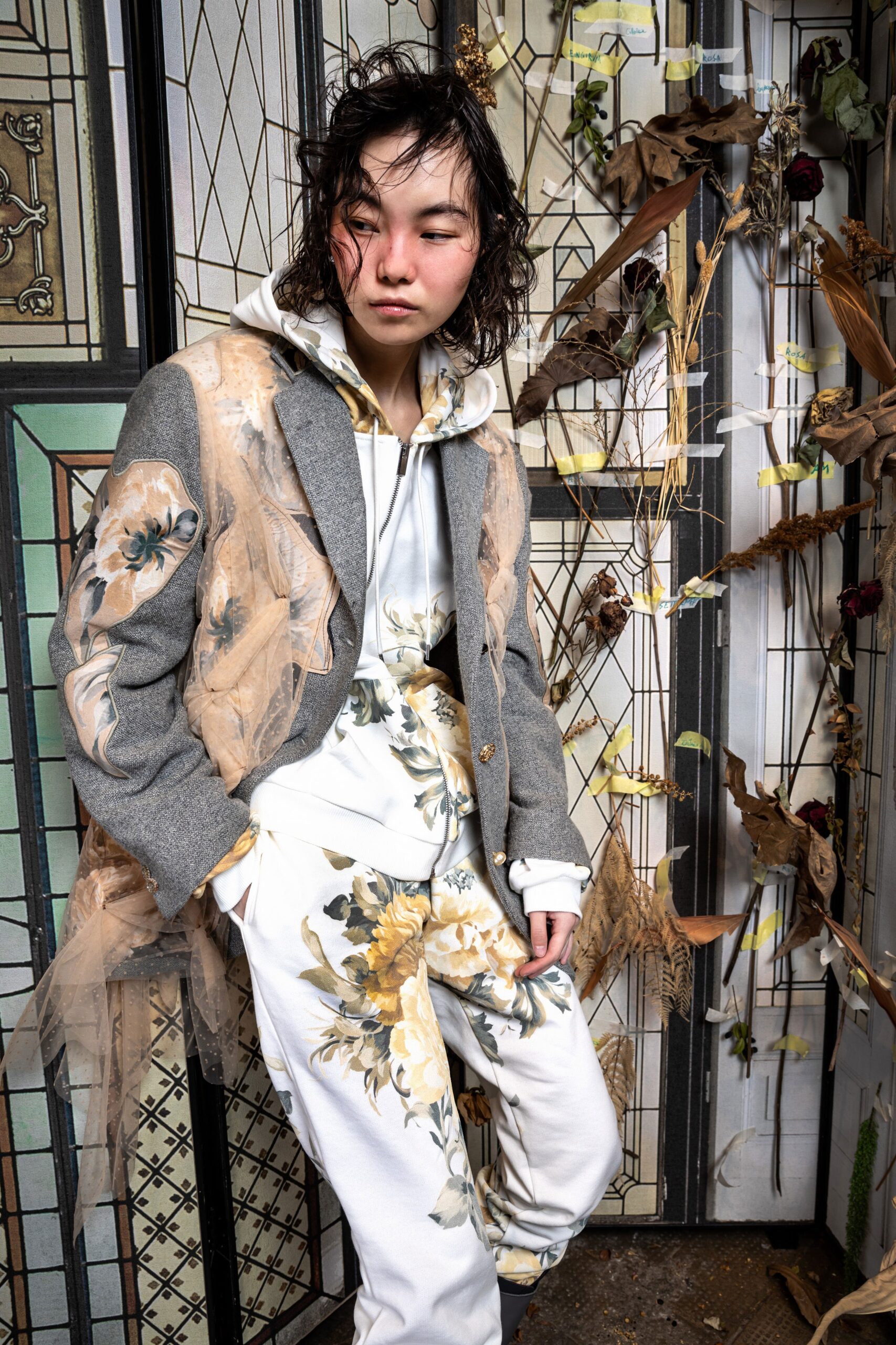 gray blazer with white hoodie and printed pants