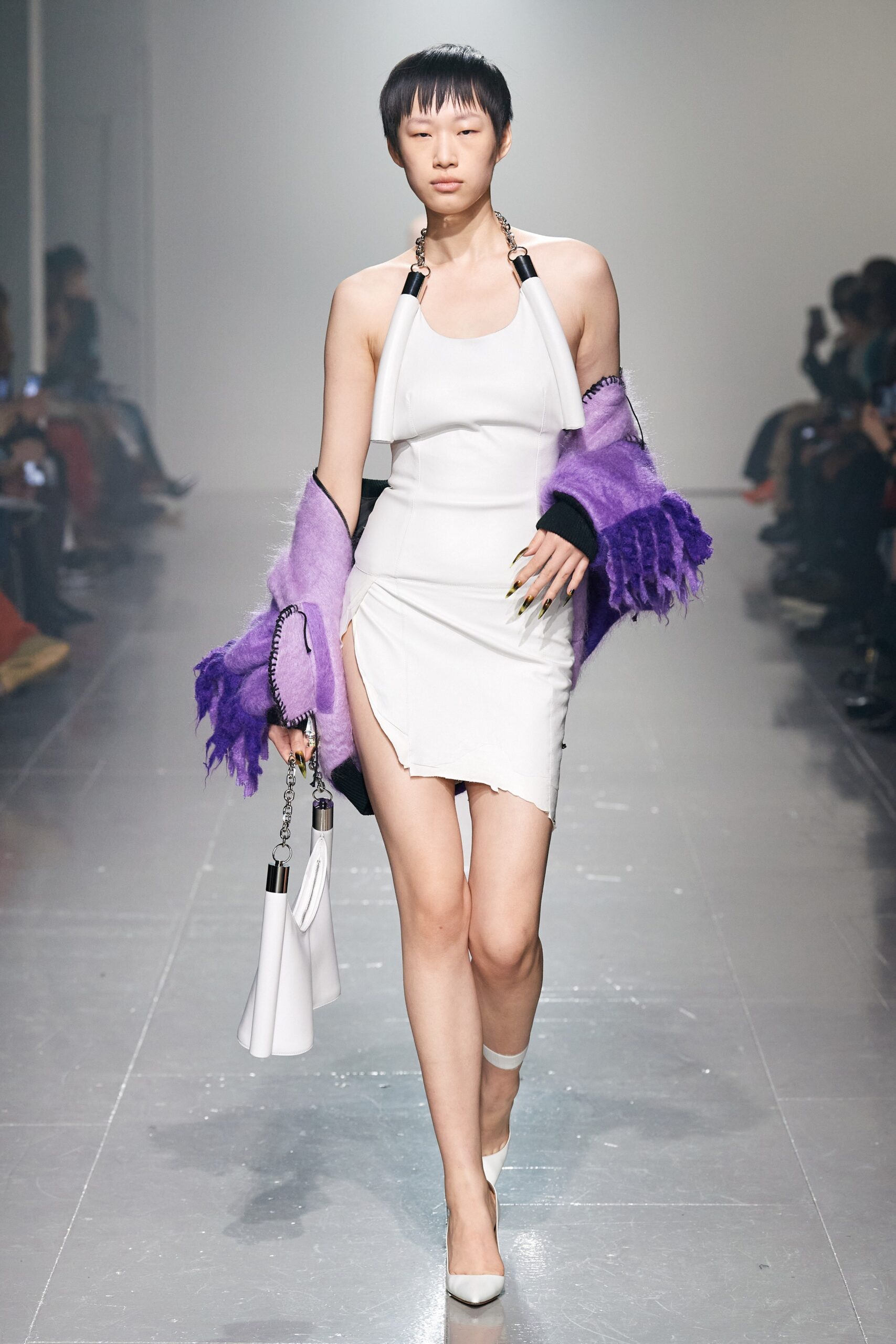 white fitted mini dress with oversized purple sweater