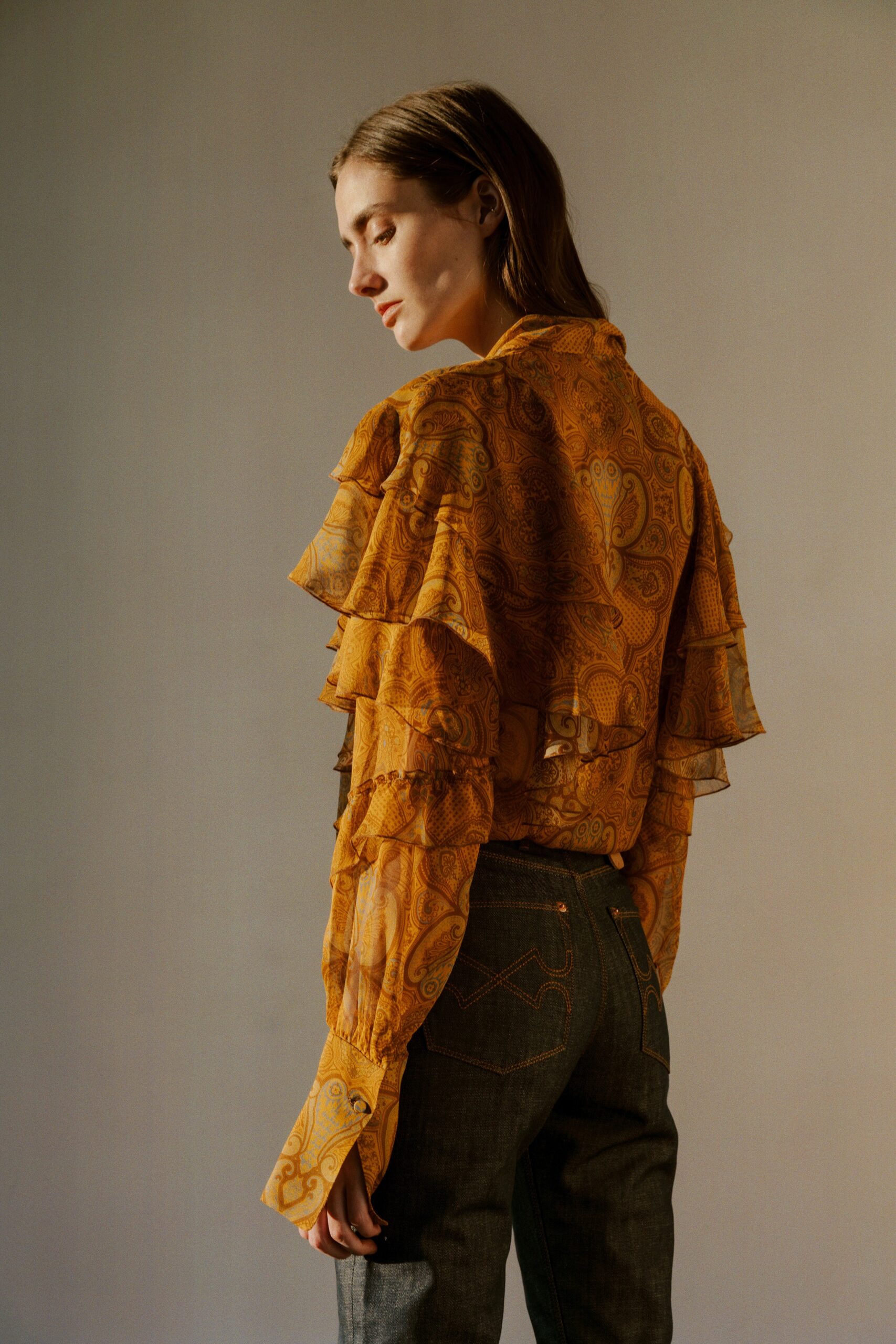 yellow silk long-sleeve collared fitted ruffled printed blouse