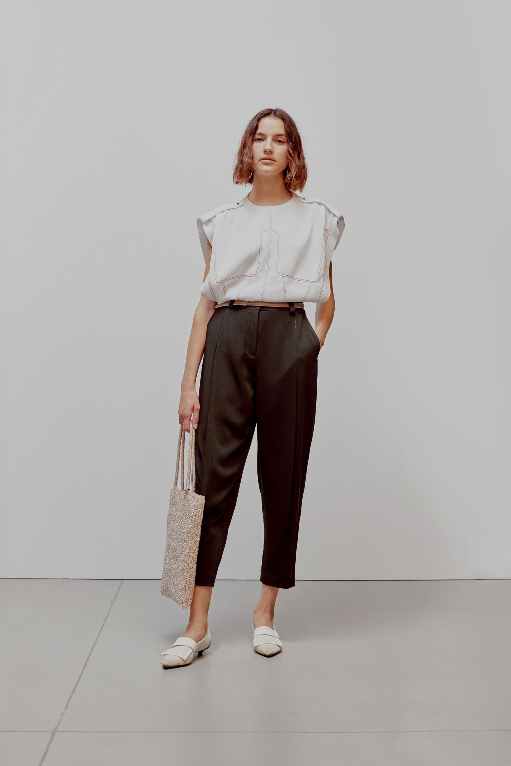 white relaxed top with black tailored pants