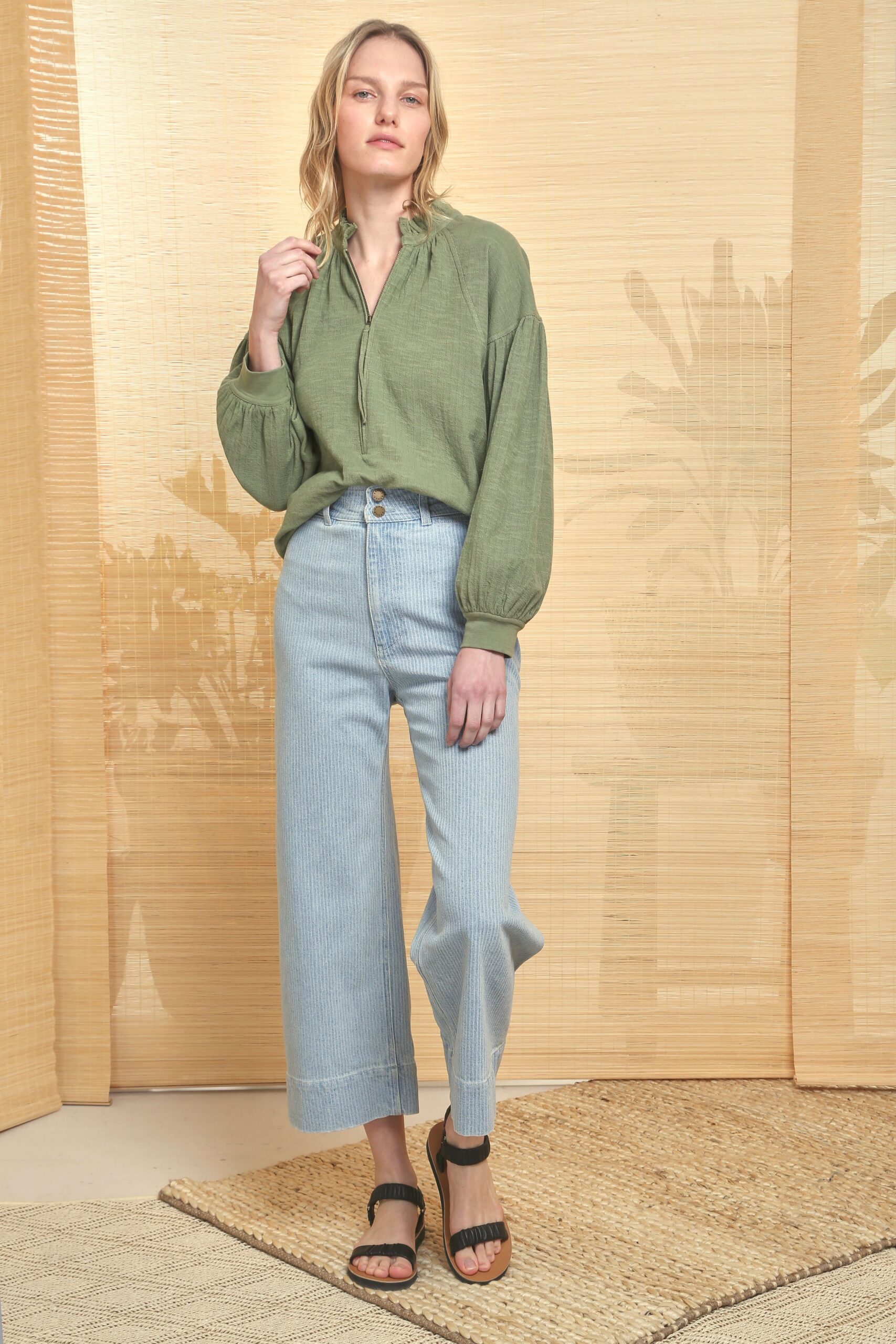green relaxed shirt with blue pants