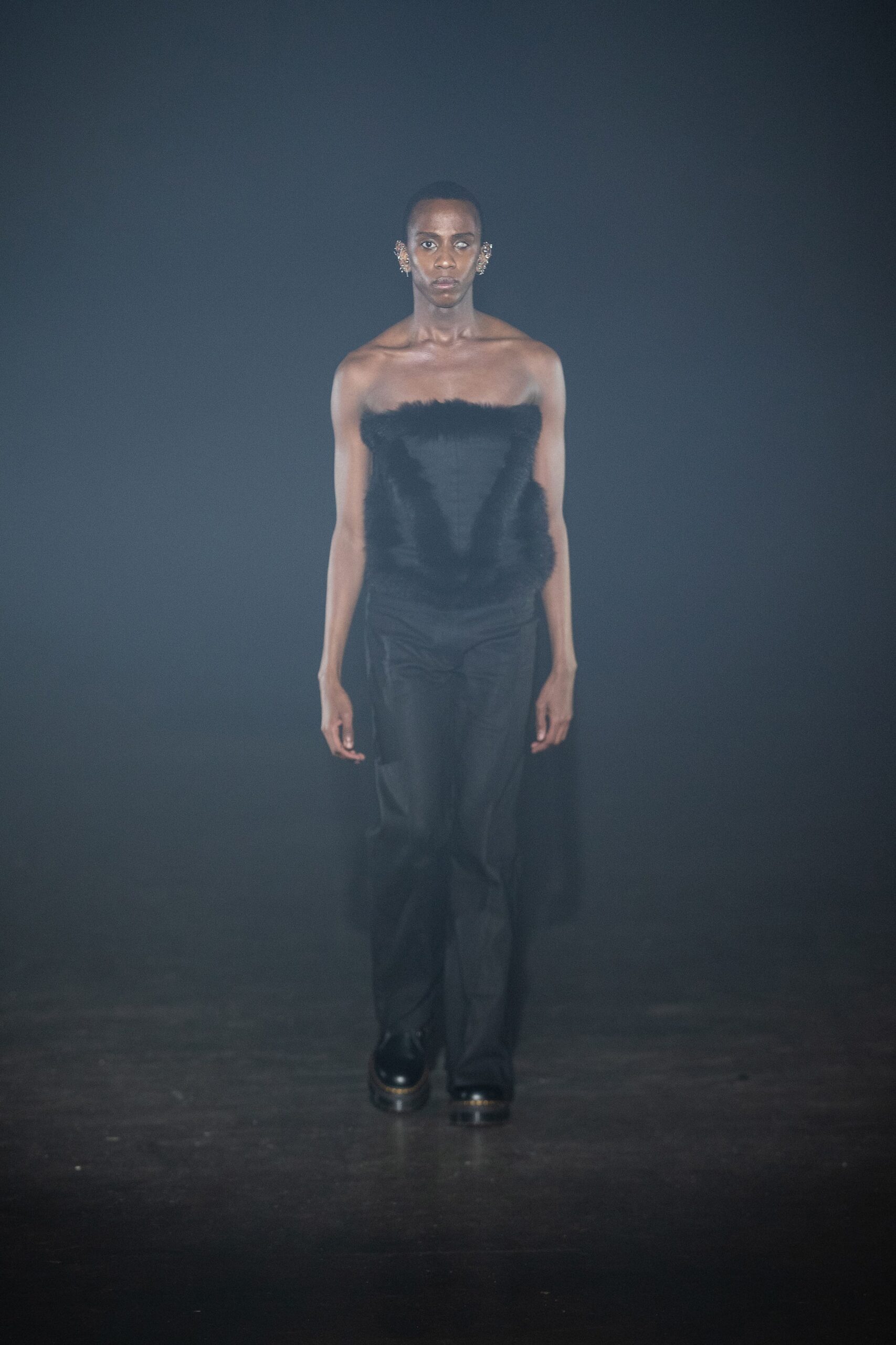 black silk strapless bustier and tailored pants