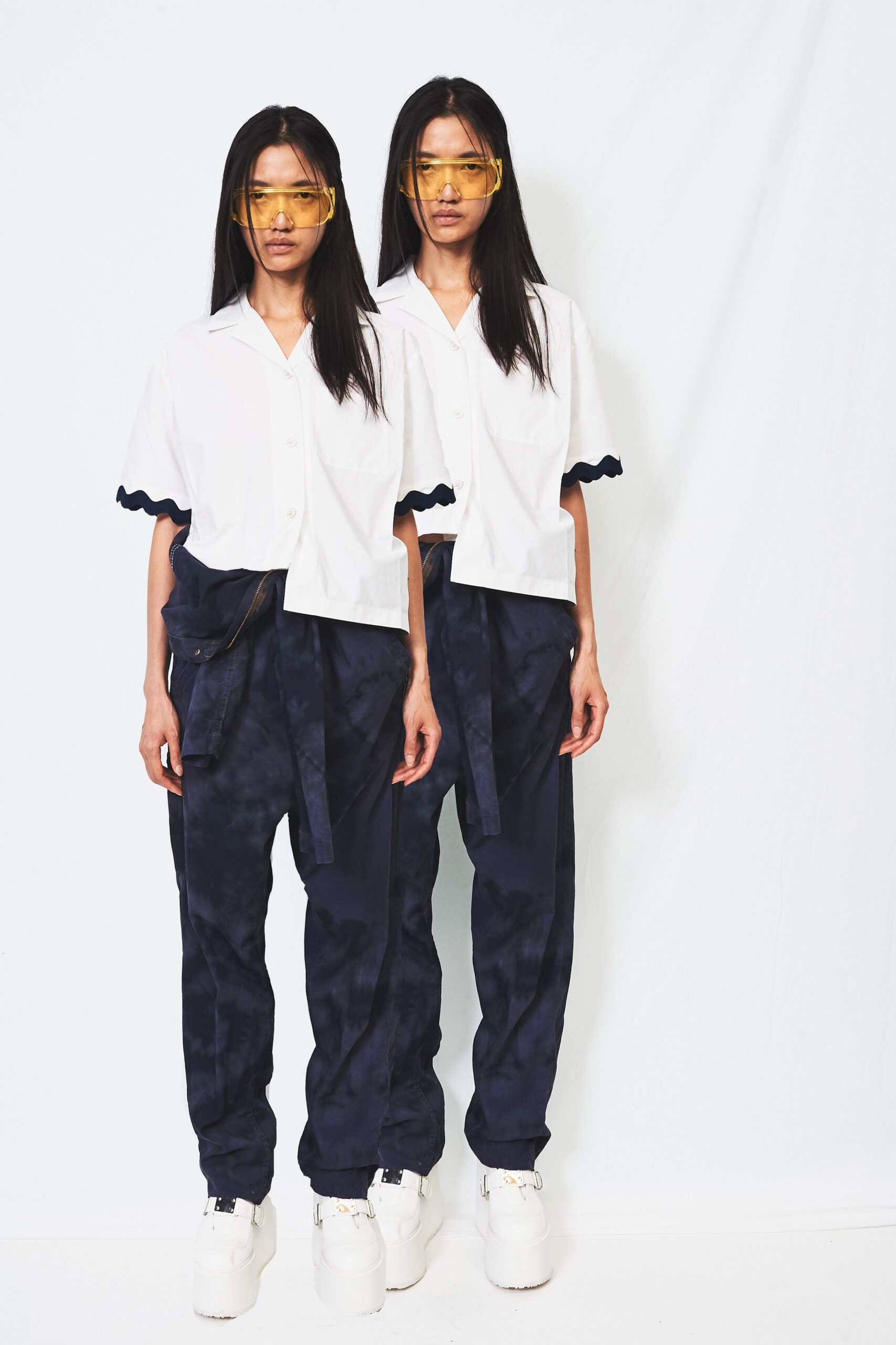 white relaxed shirt with blue pants