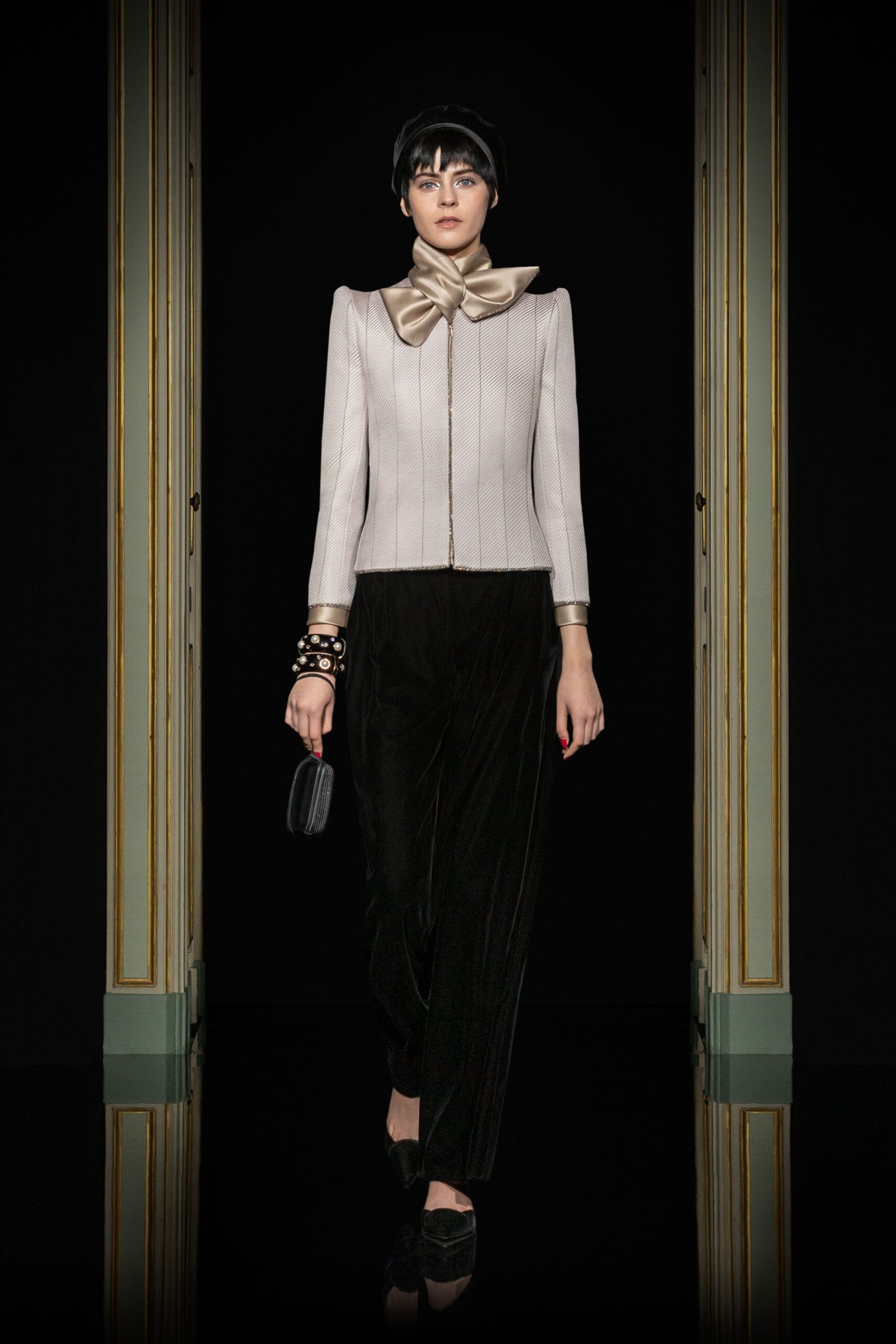 beige silk fitted blazer and black velvet pants