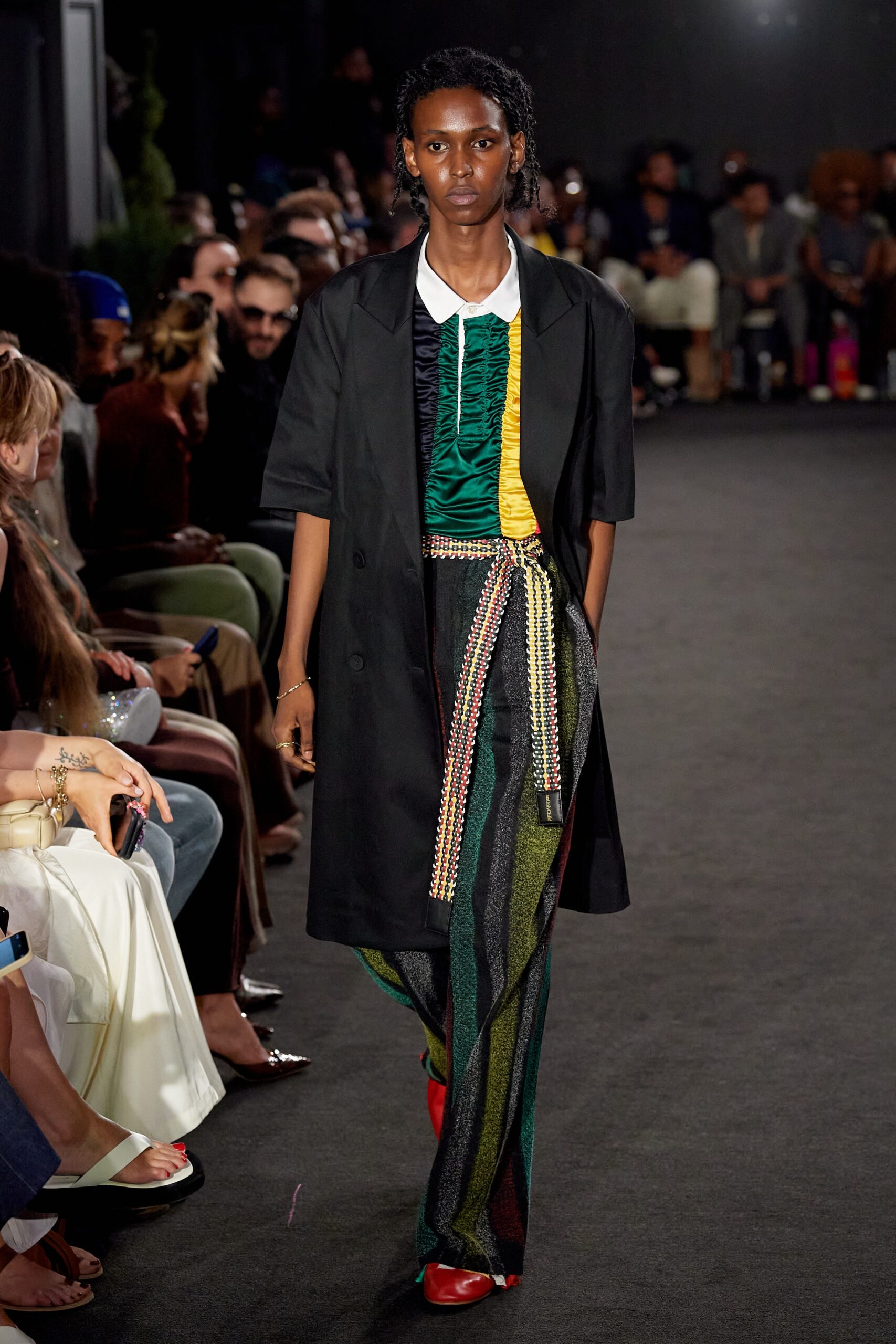 black coat with multi-colored pants