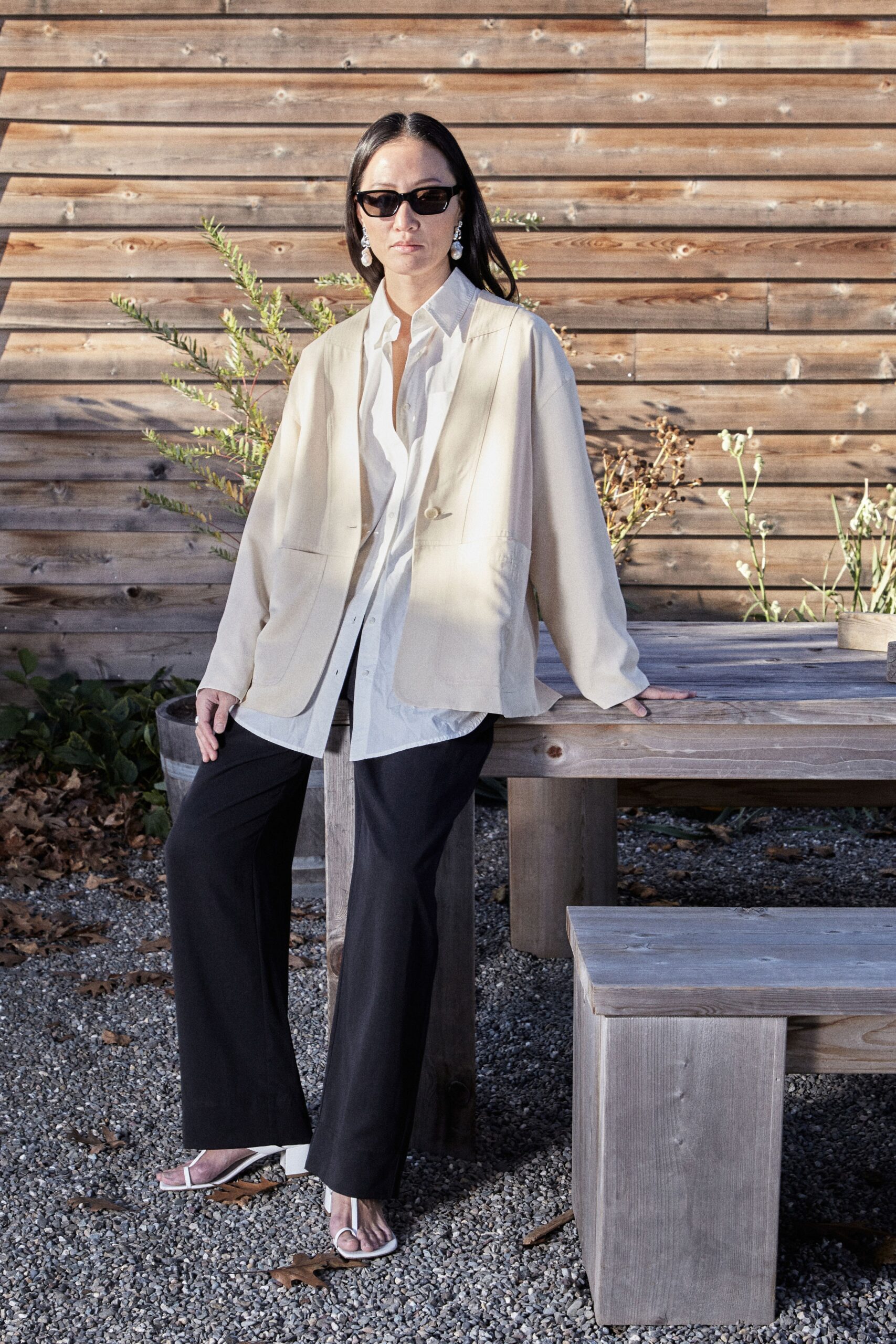 white blouse beige jacket black pants