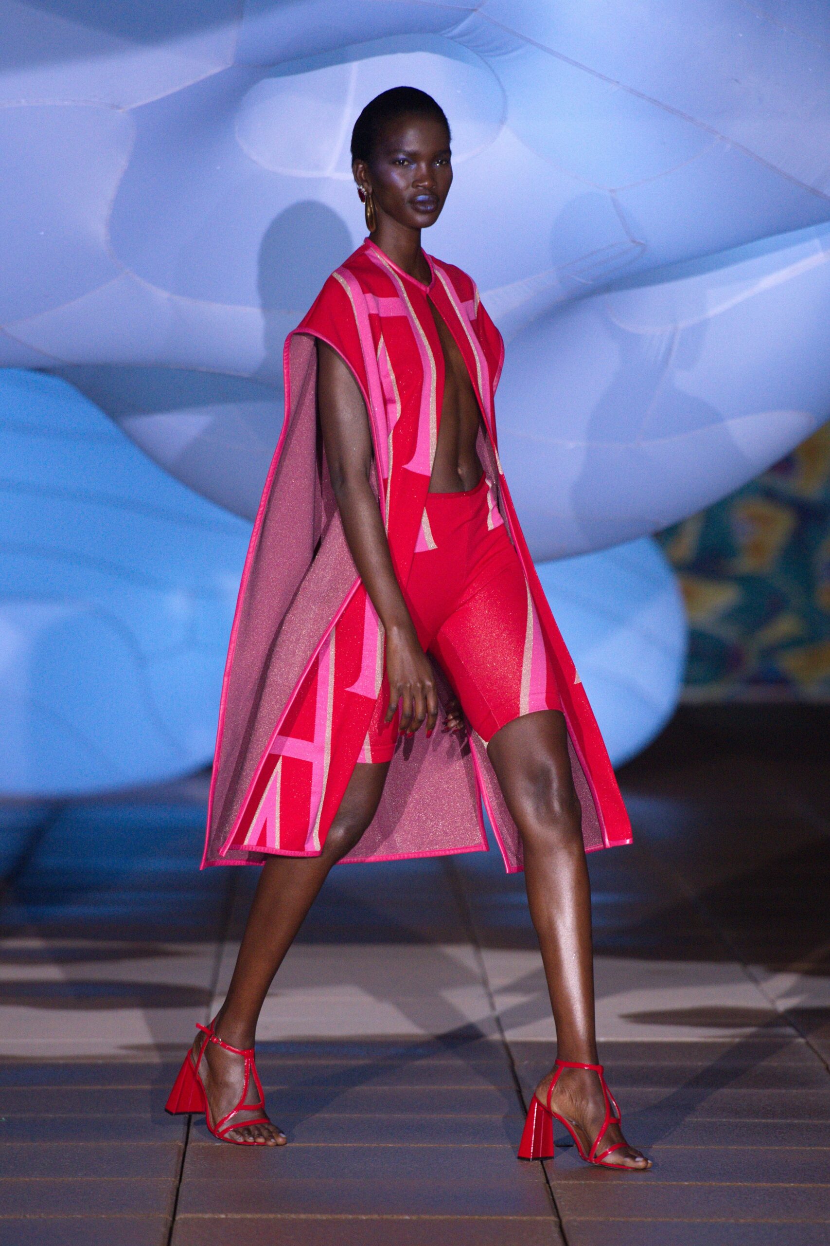 red cape and bodysuit ensemble