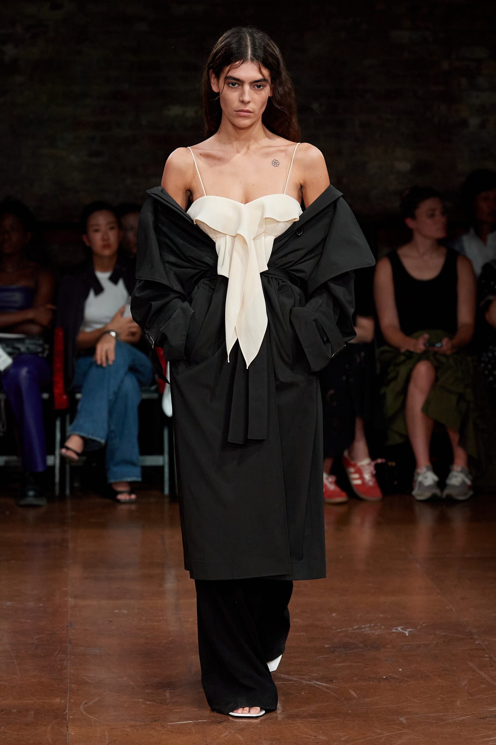 black coat white fitted top black pants