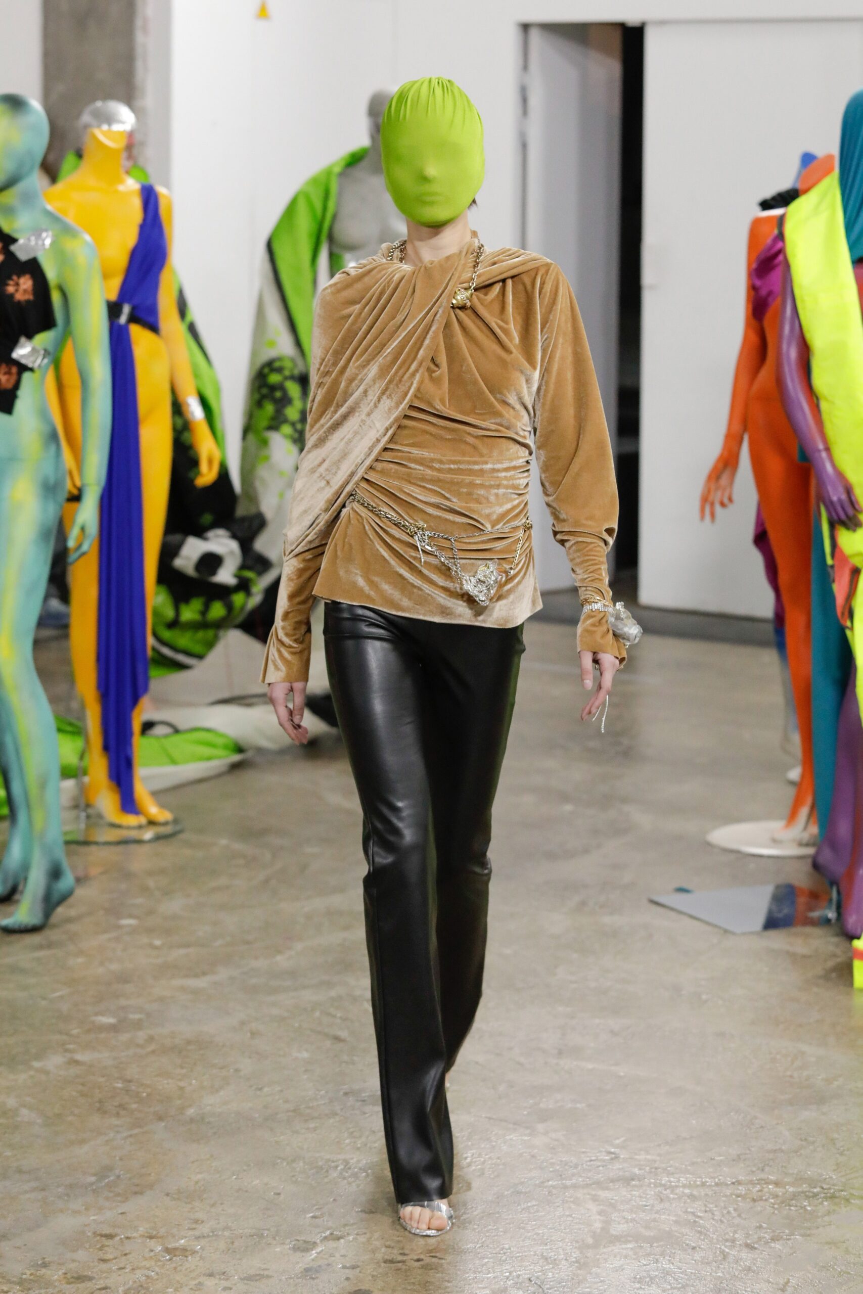 fitted beige velvet top and black leather pants