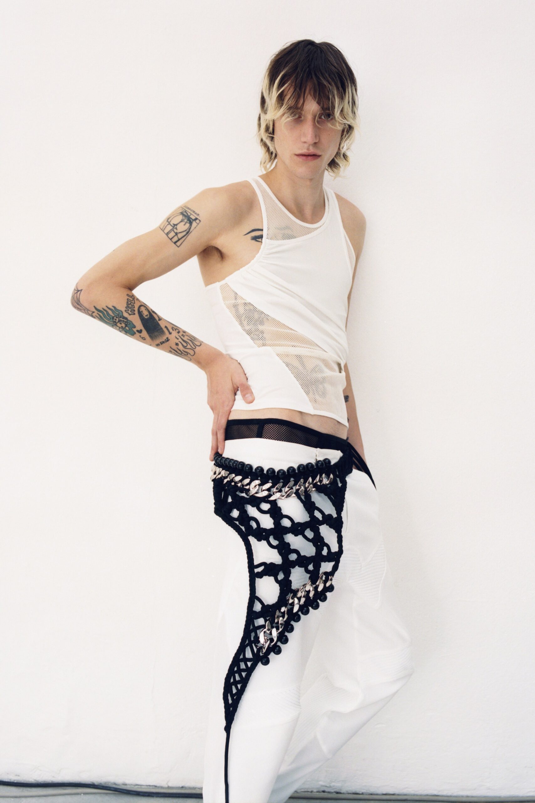 white tank-top and relaxed pants