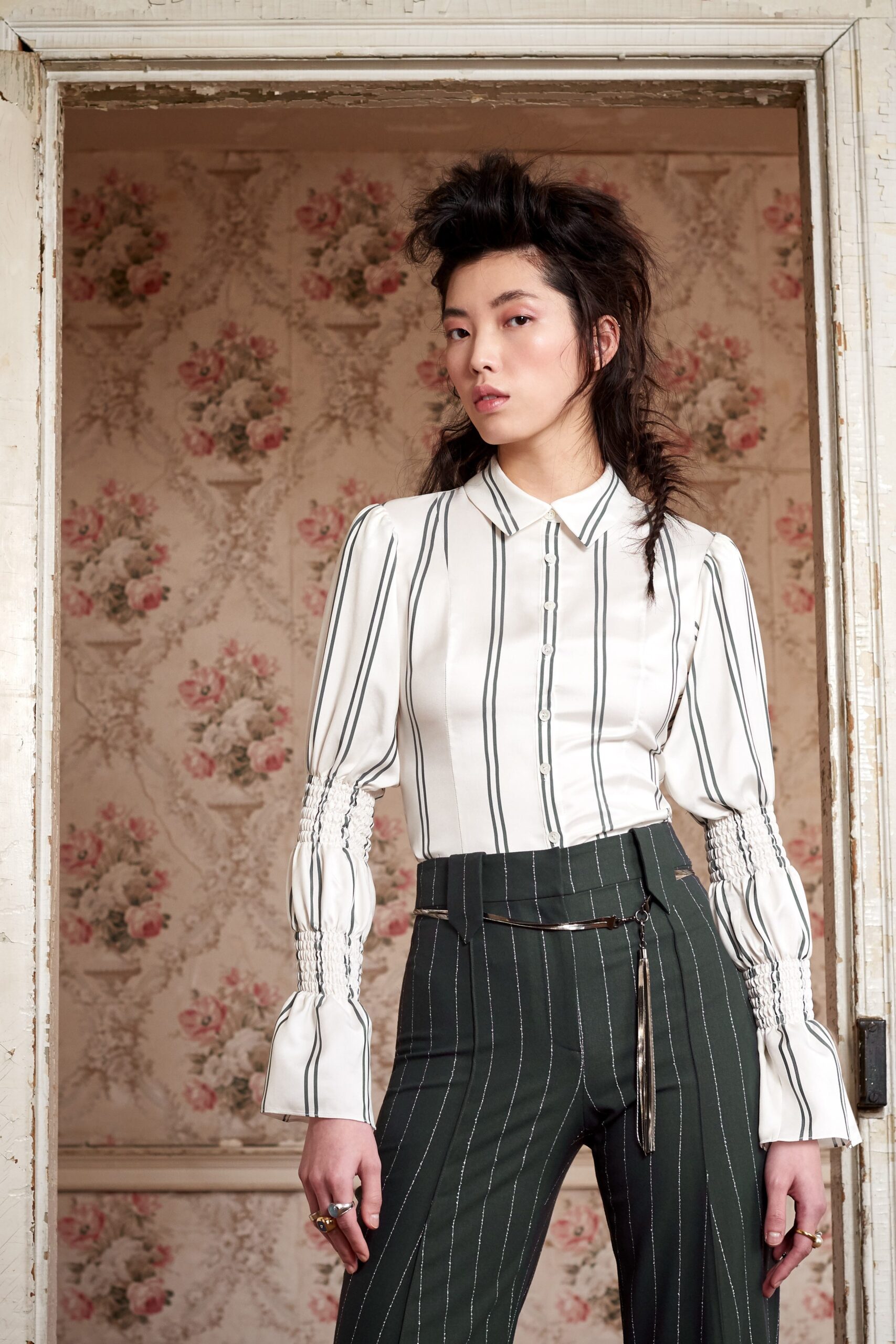 fitted white silk shirt and tailored green pants