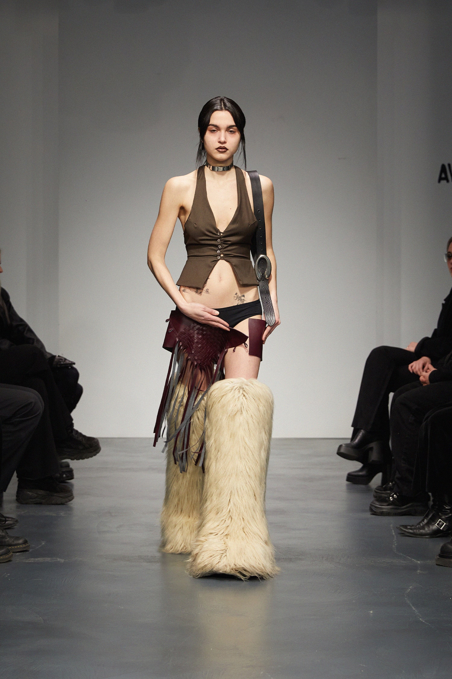 brown sleeveless top with fringed details