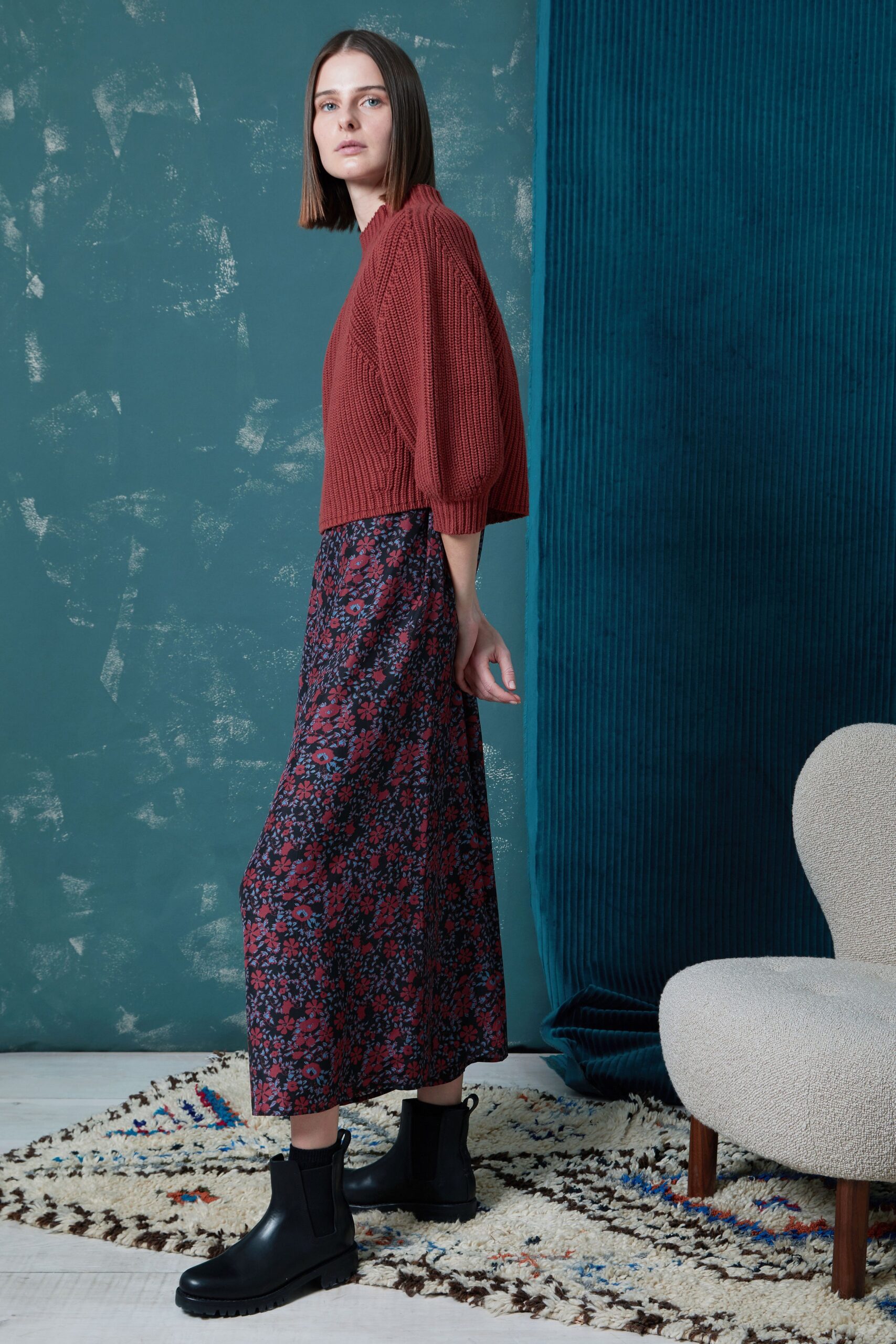 red fitted top with floral midi skirt