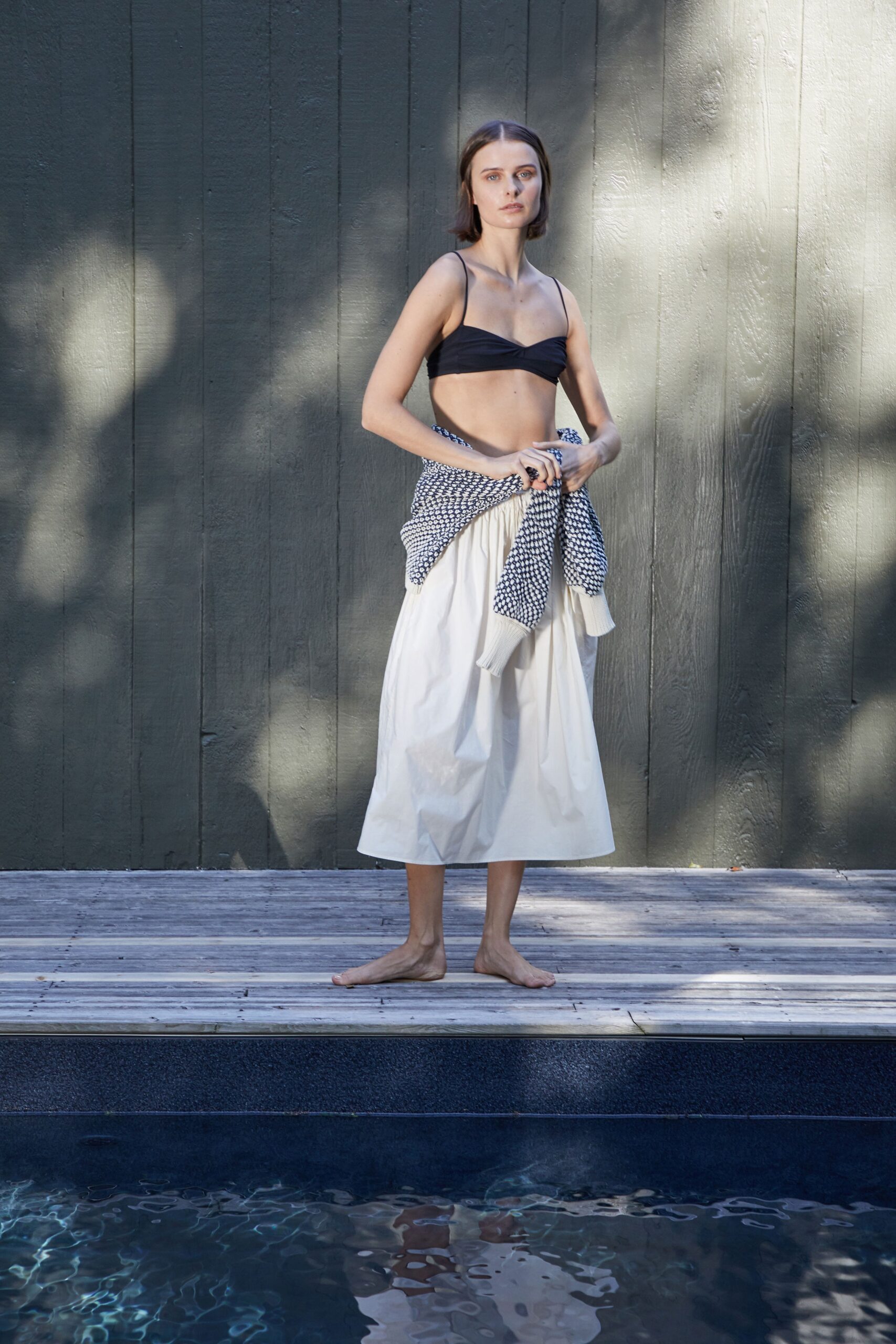 black bikini and white tiered skirt