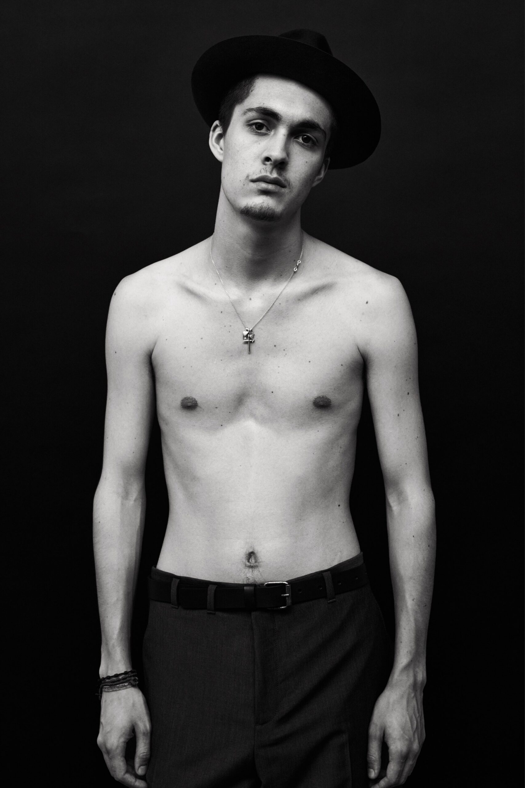 gray fitted pants and black hat