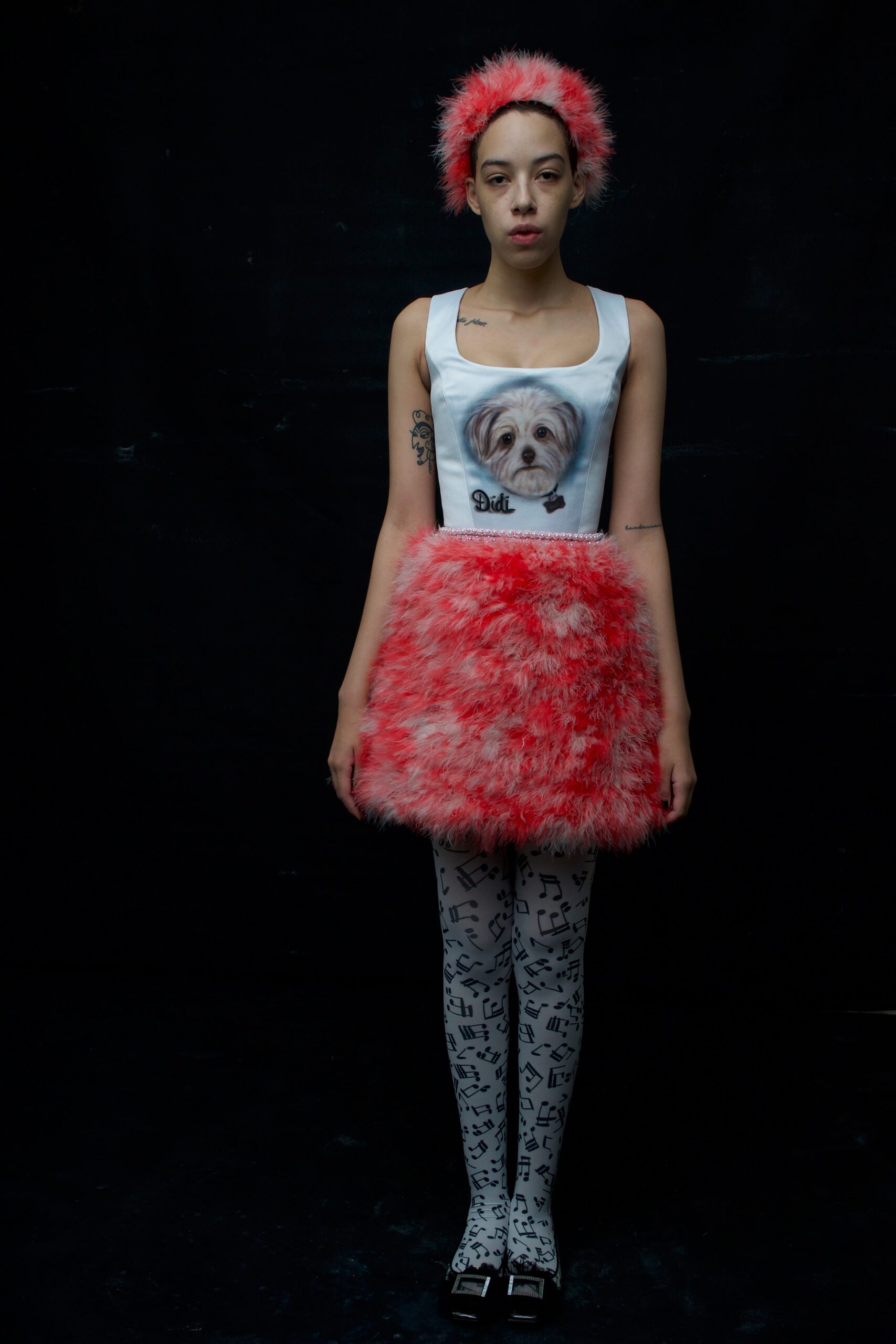 white printed top with pink skirt