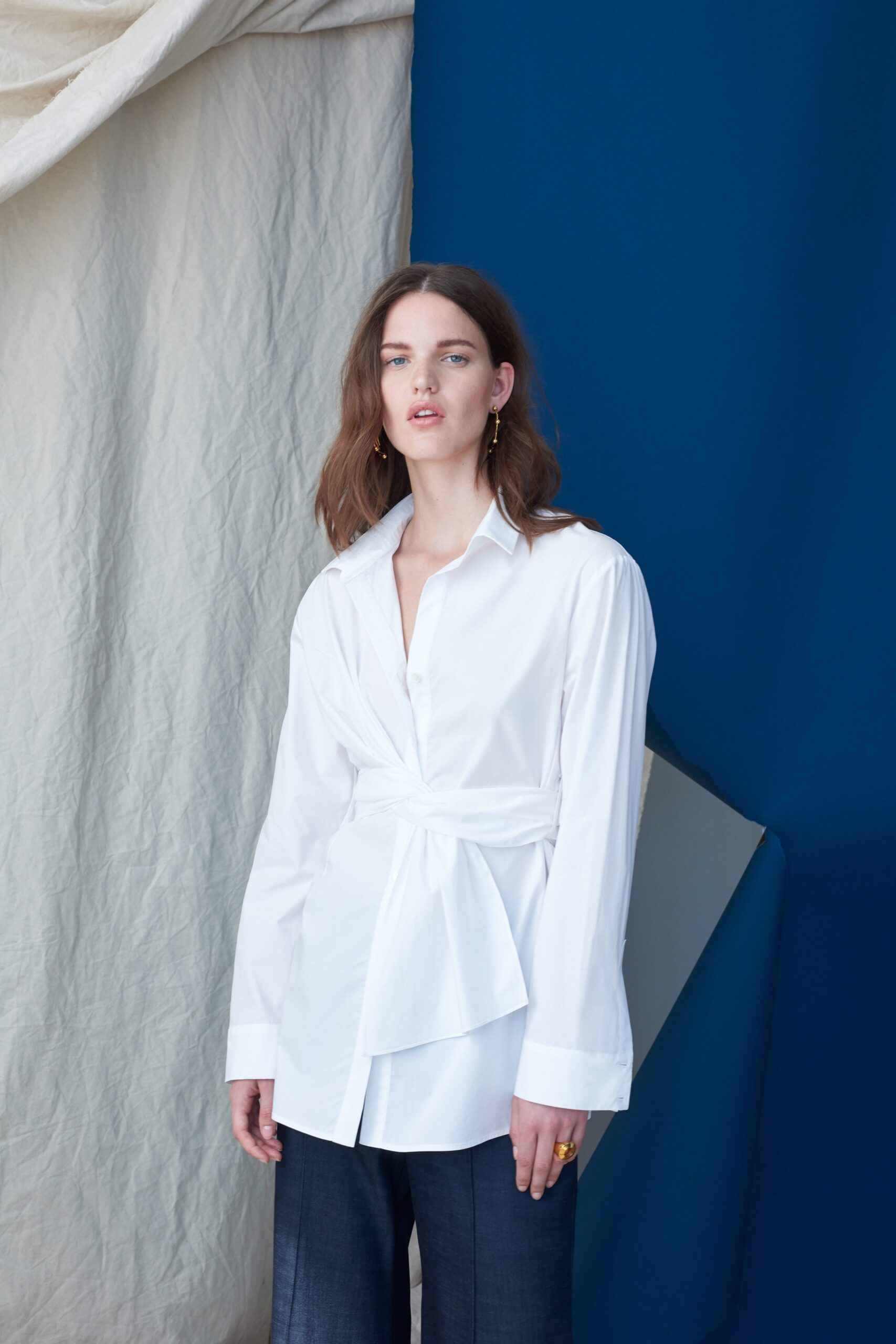 white cotton long-sleeve collared fitted buttoned draped shirt