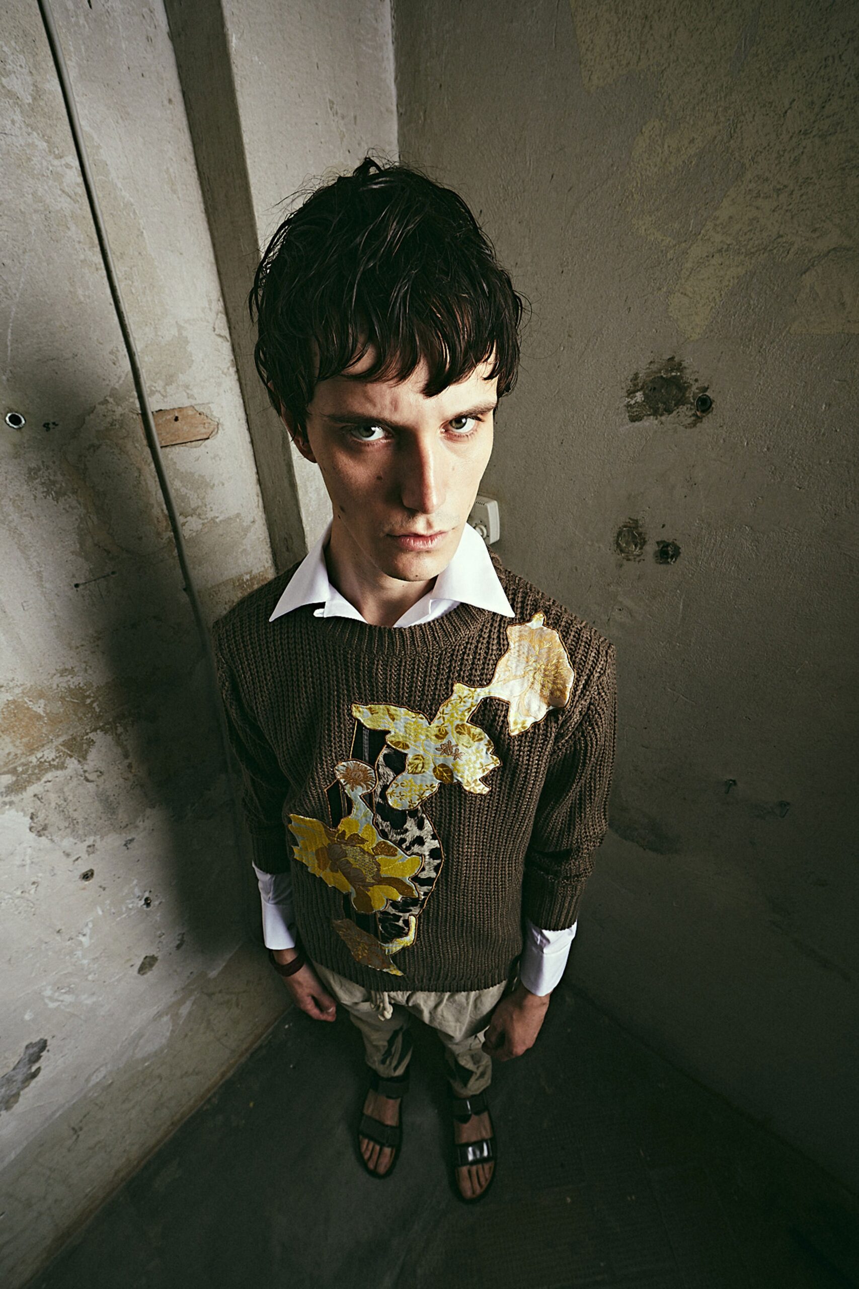 brown embroidered sweater with beige pants