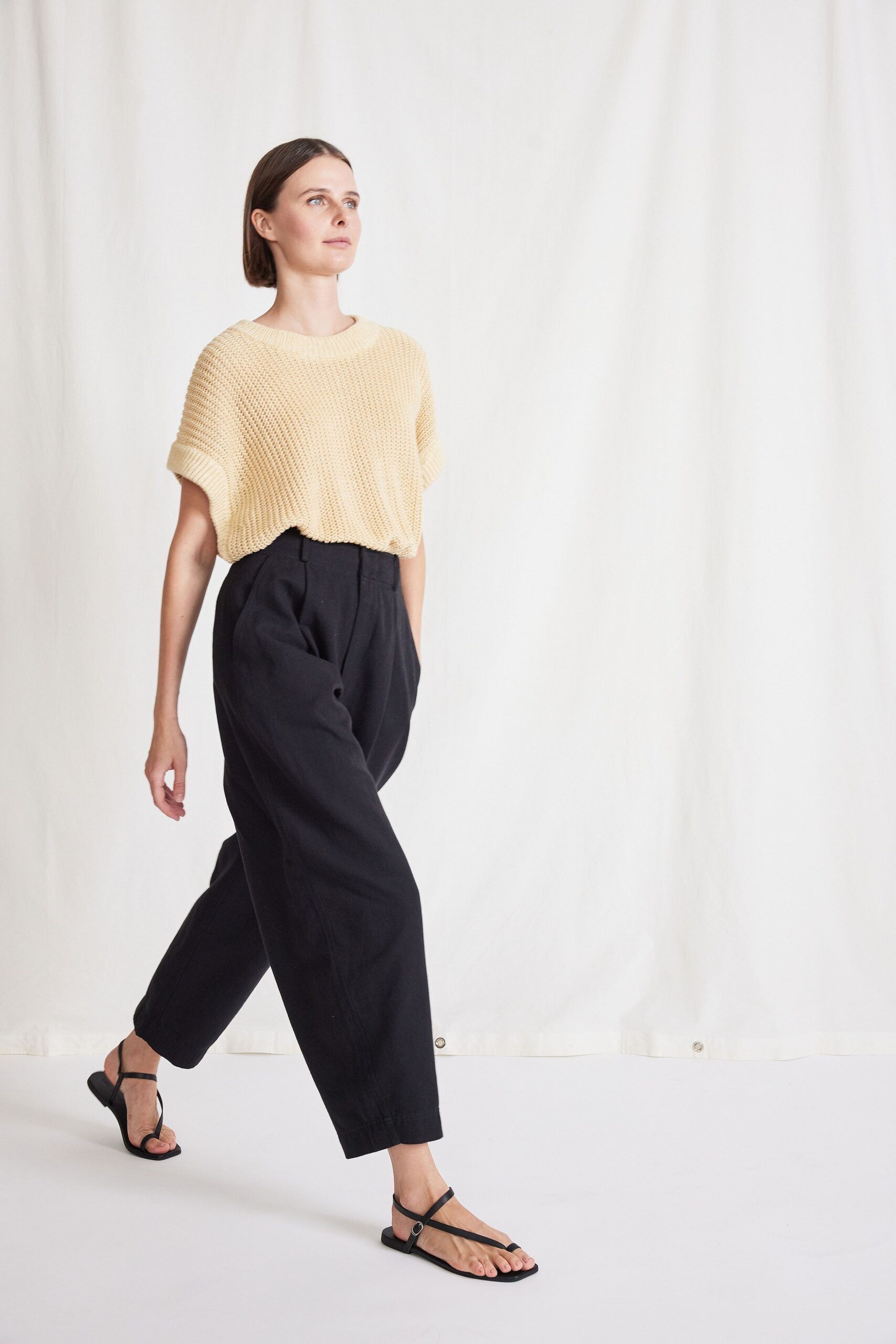 beige relaxed top with black pants
