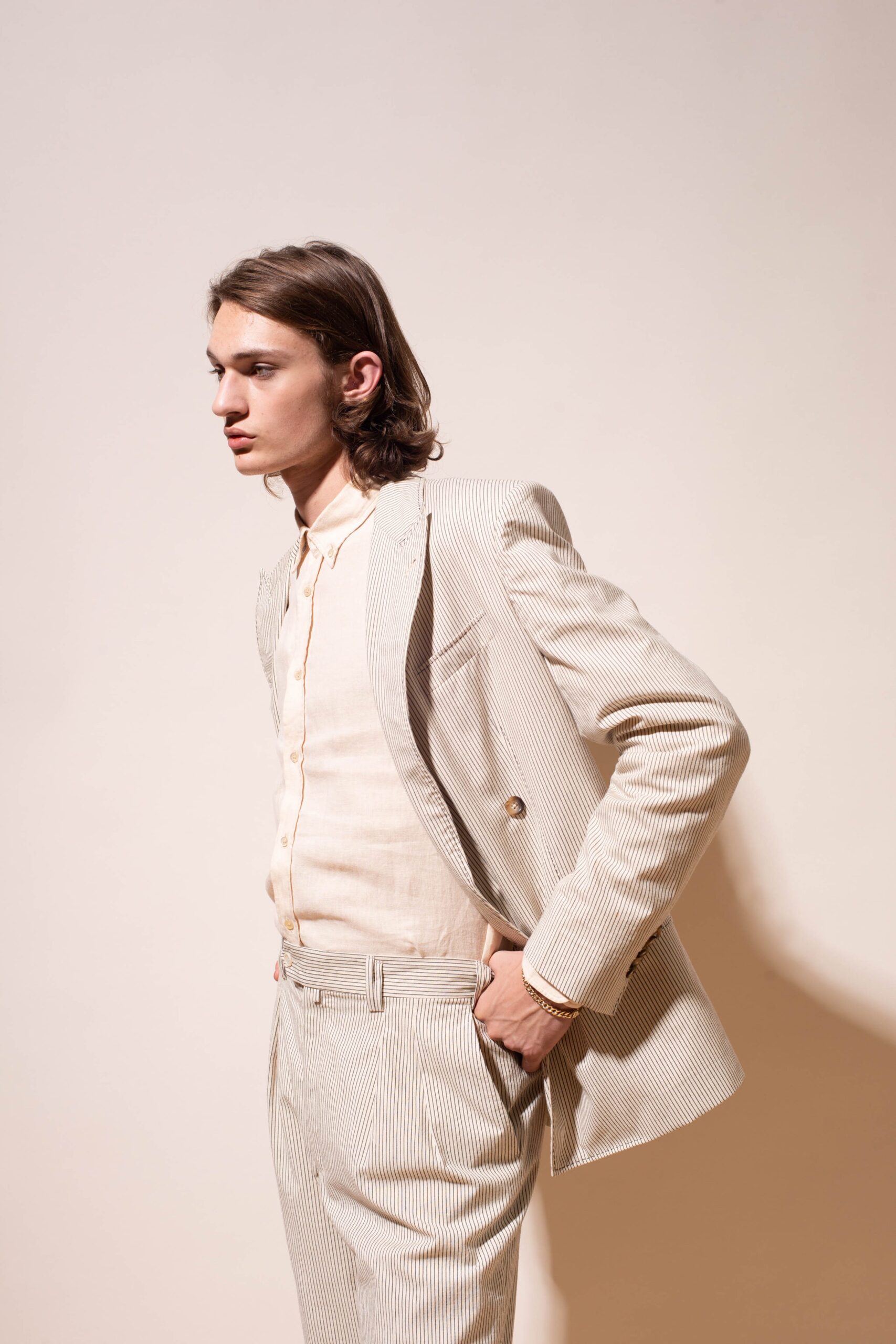 beige tailored suit with white shirt