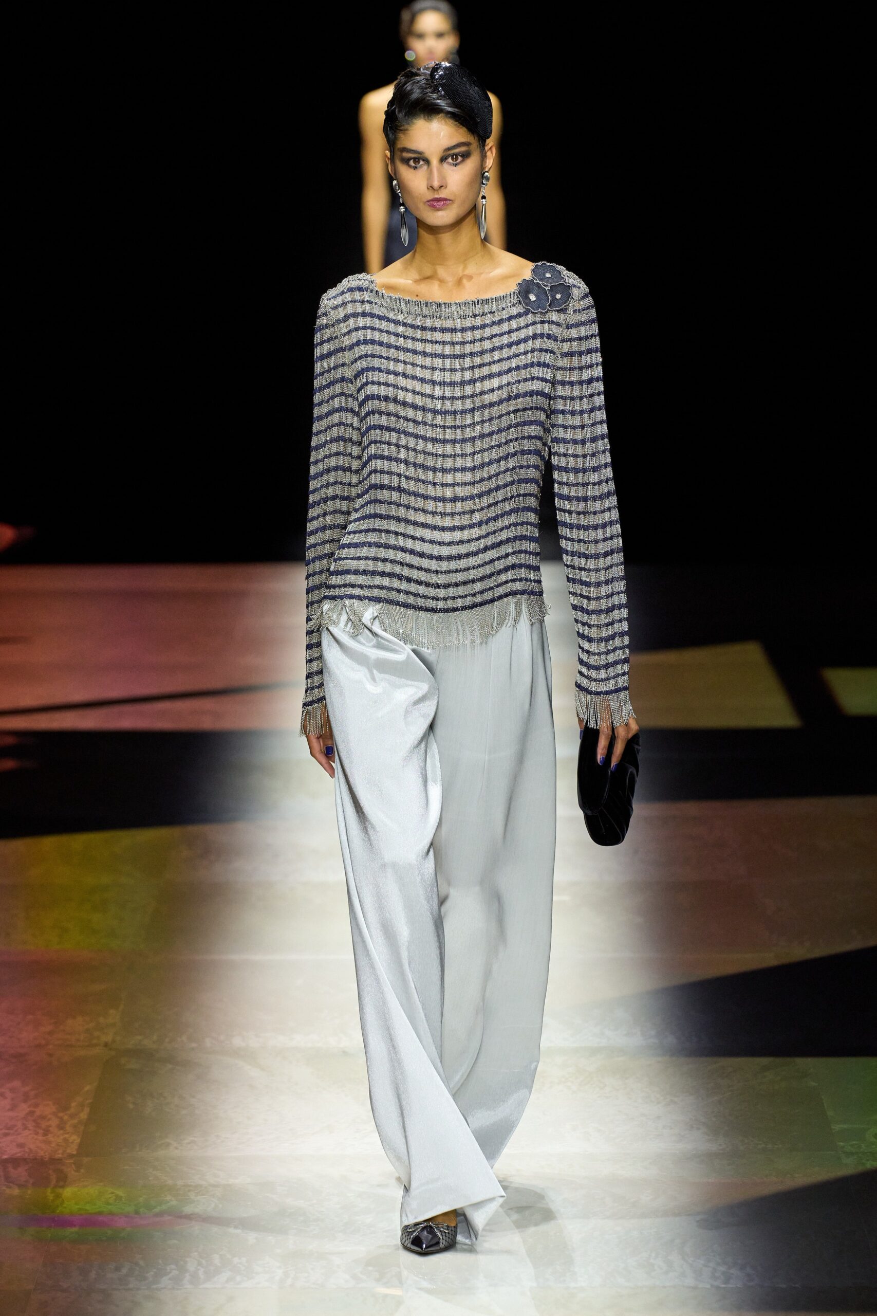 gray striped relaxed top with white pants