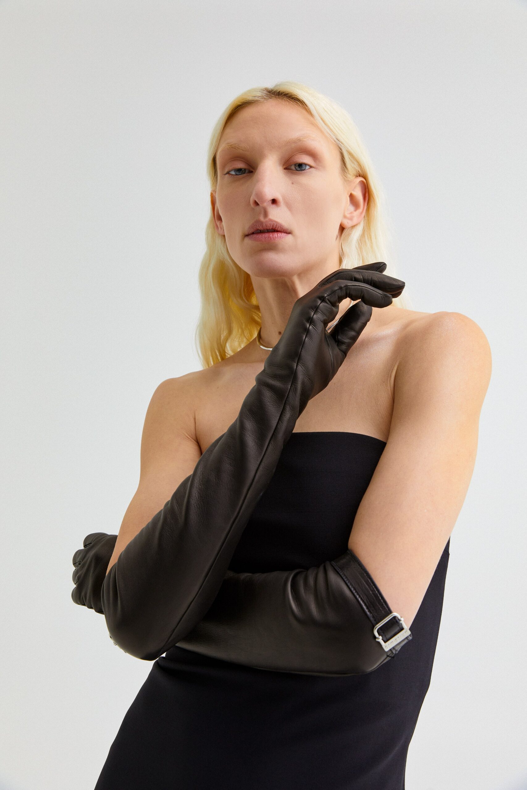 black fitted mini dress with gloves