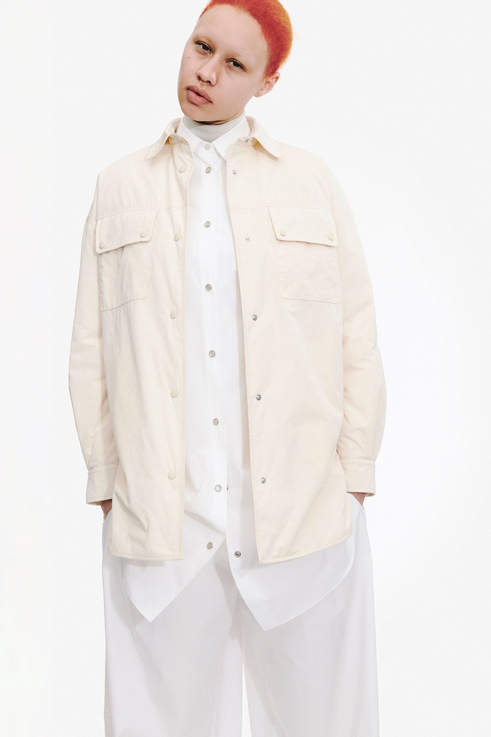 white oversized jacket with relaxed shirt and pants