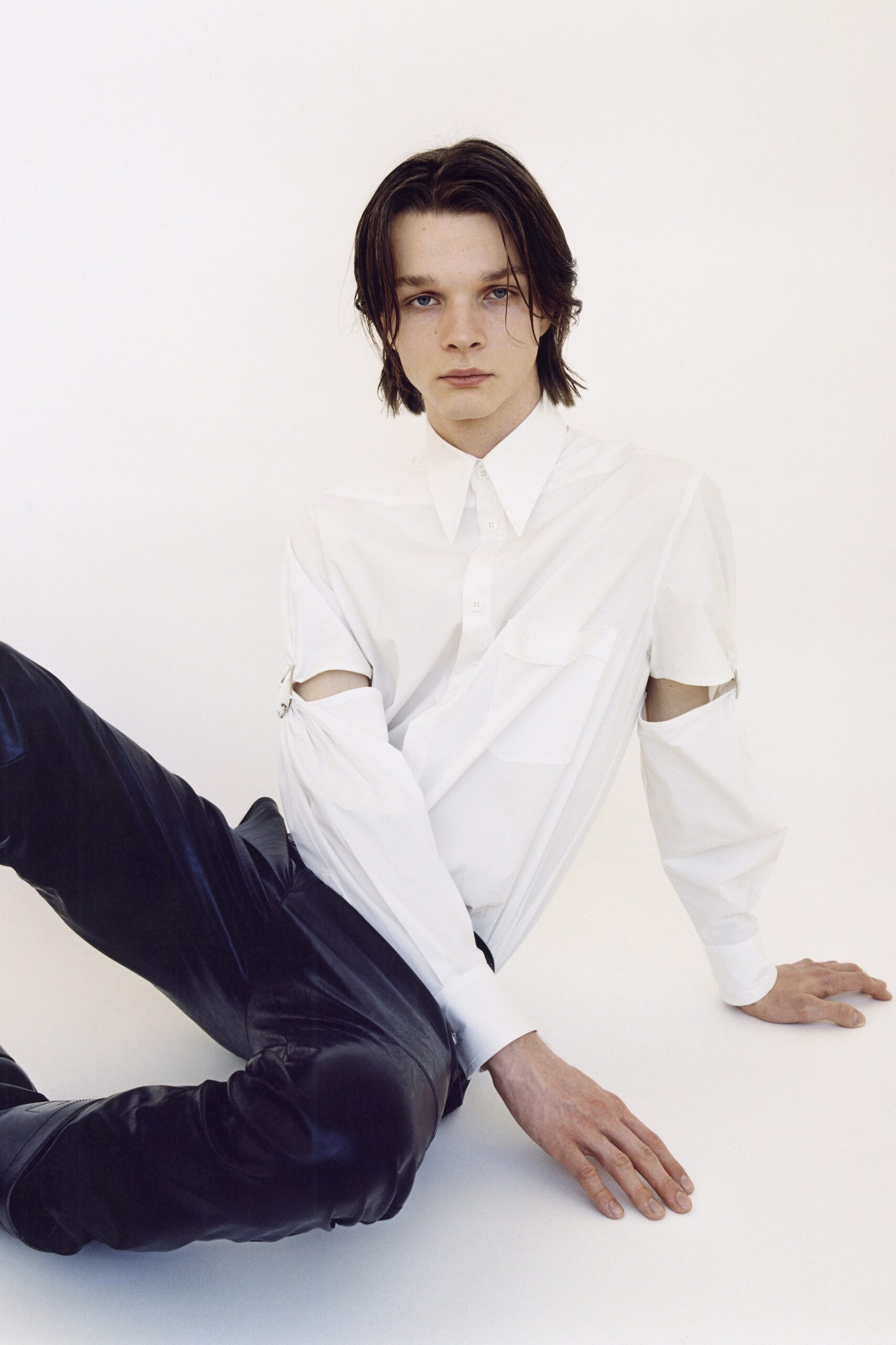 white fitted shirt and black leather pants