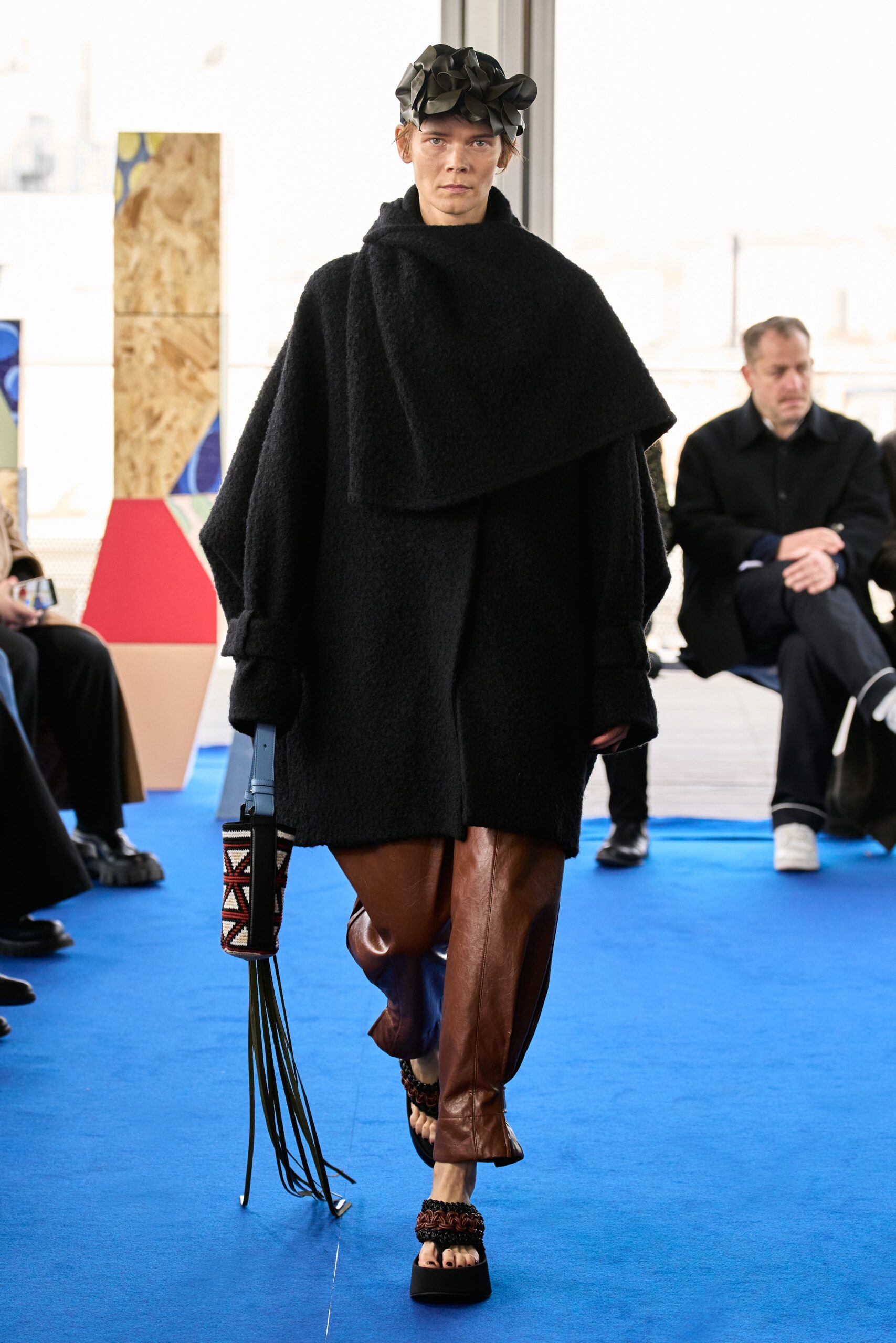black wool coat brown leather pants