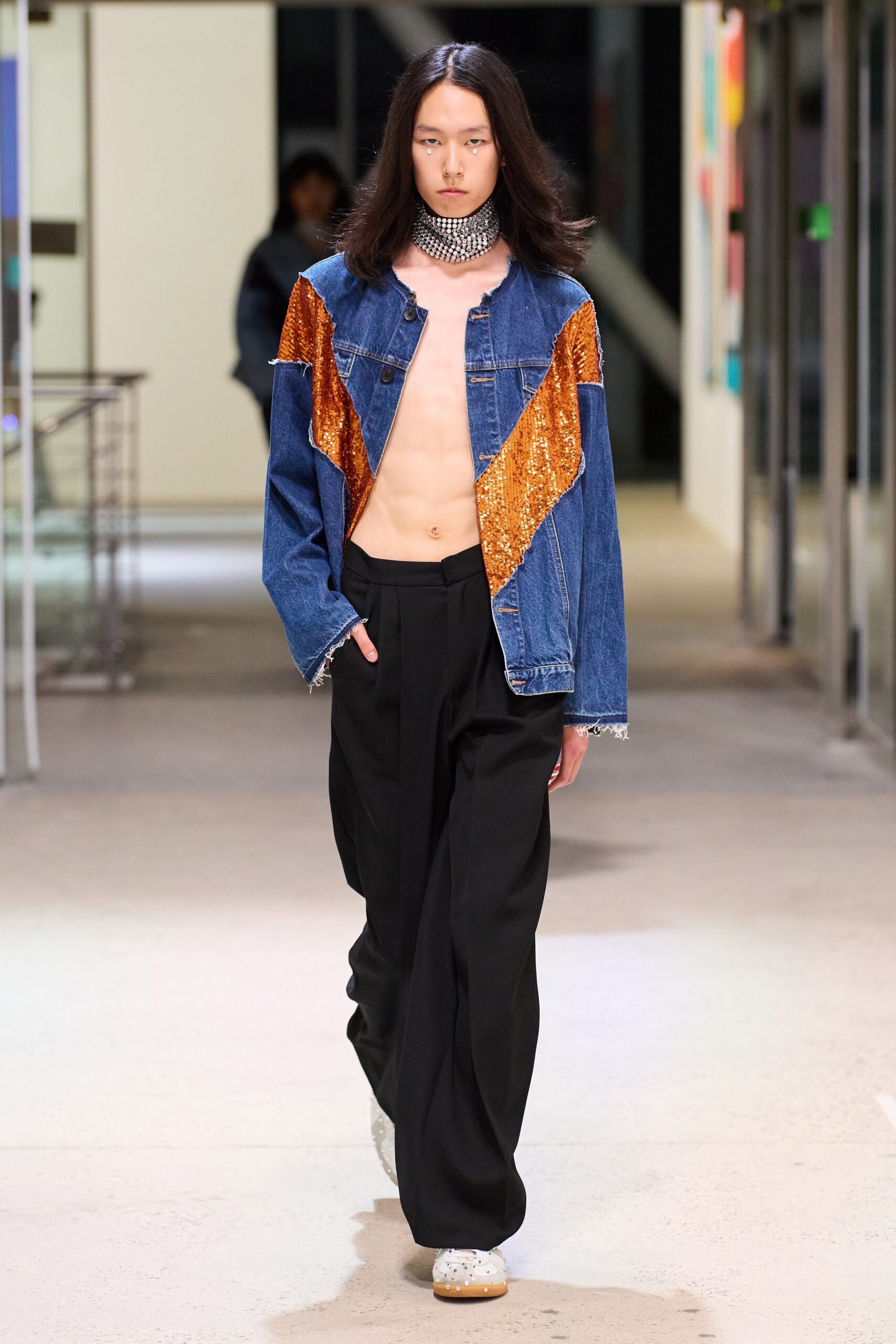 blue sequin denim jacket and black pants