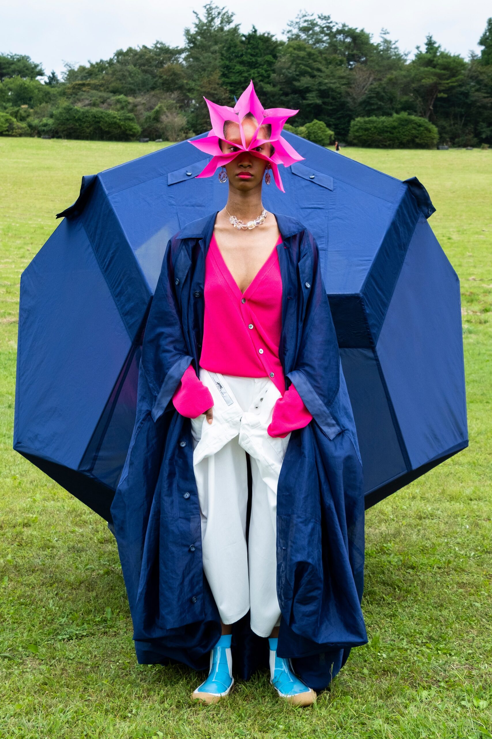 navy coat pink top white pants