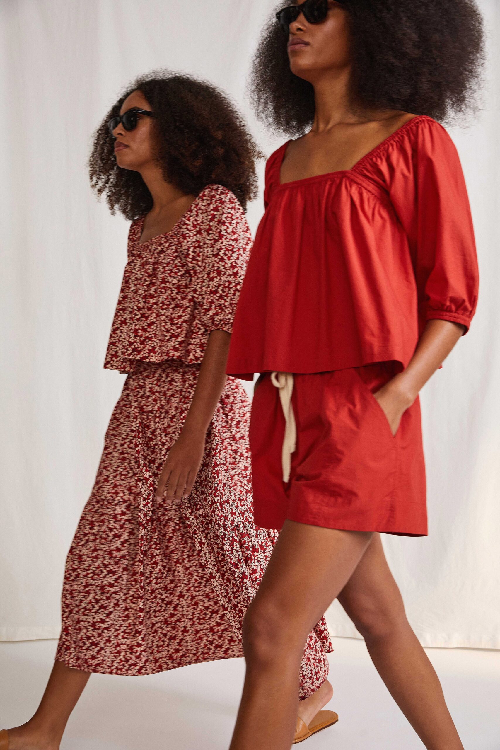 red top and shorts with floral dress