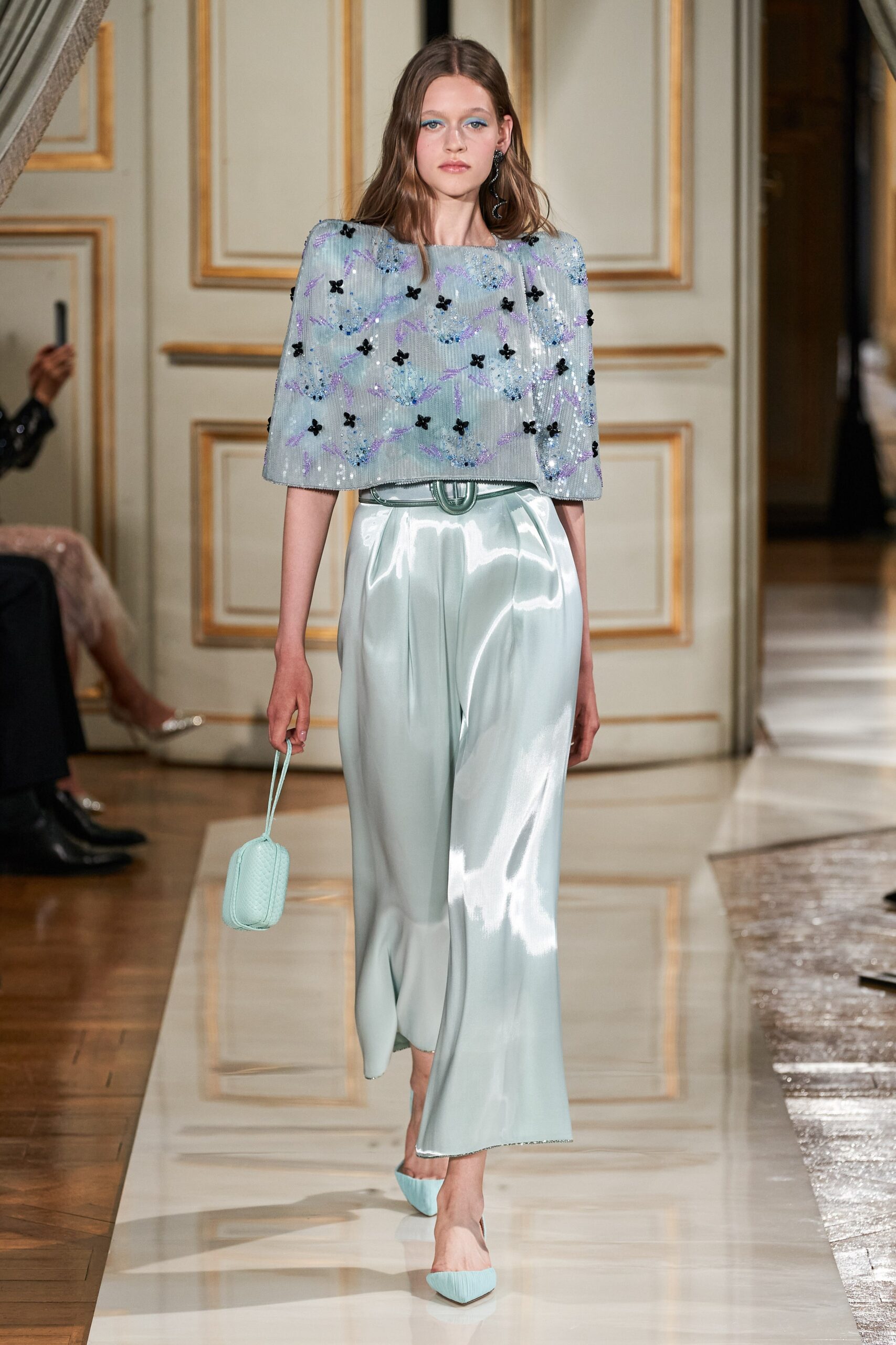 blue embellished cape and mint pants