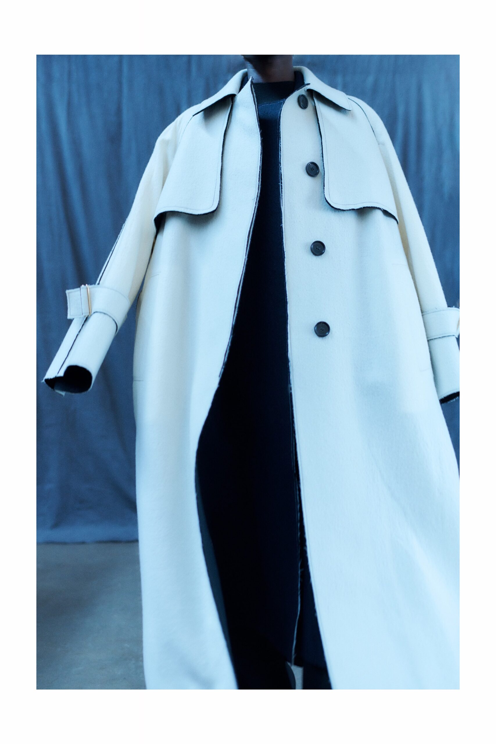 white wool long-sleeve collared relaxed buttoned maxi coat
