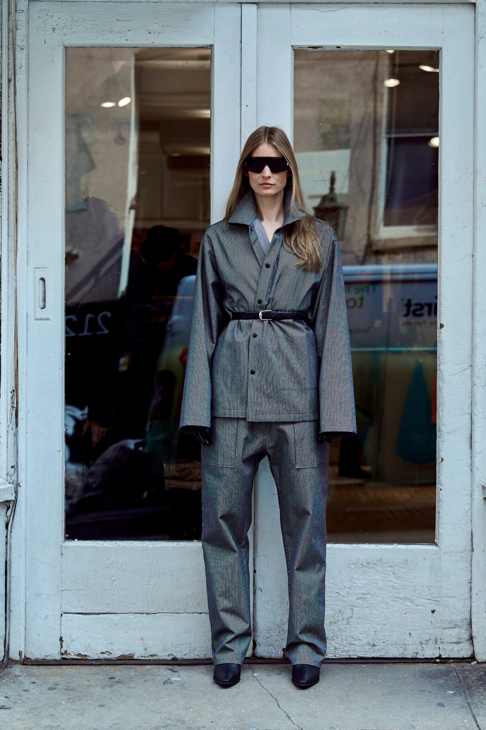 gray tailored suit with sunglasses