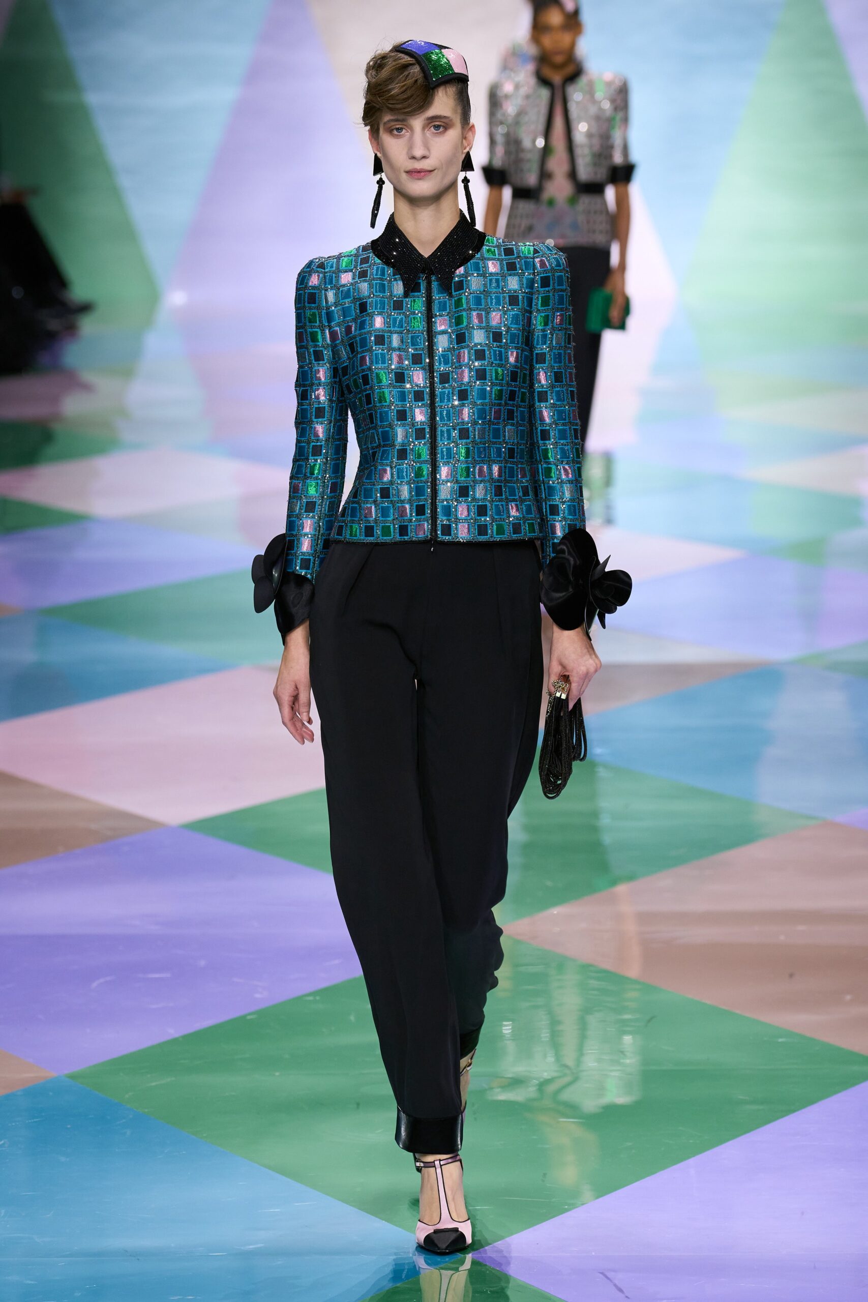 blue embellished jacket with black pants