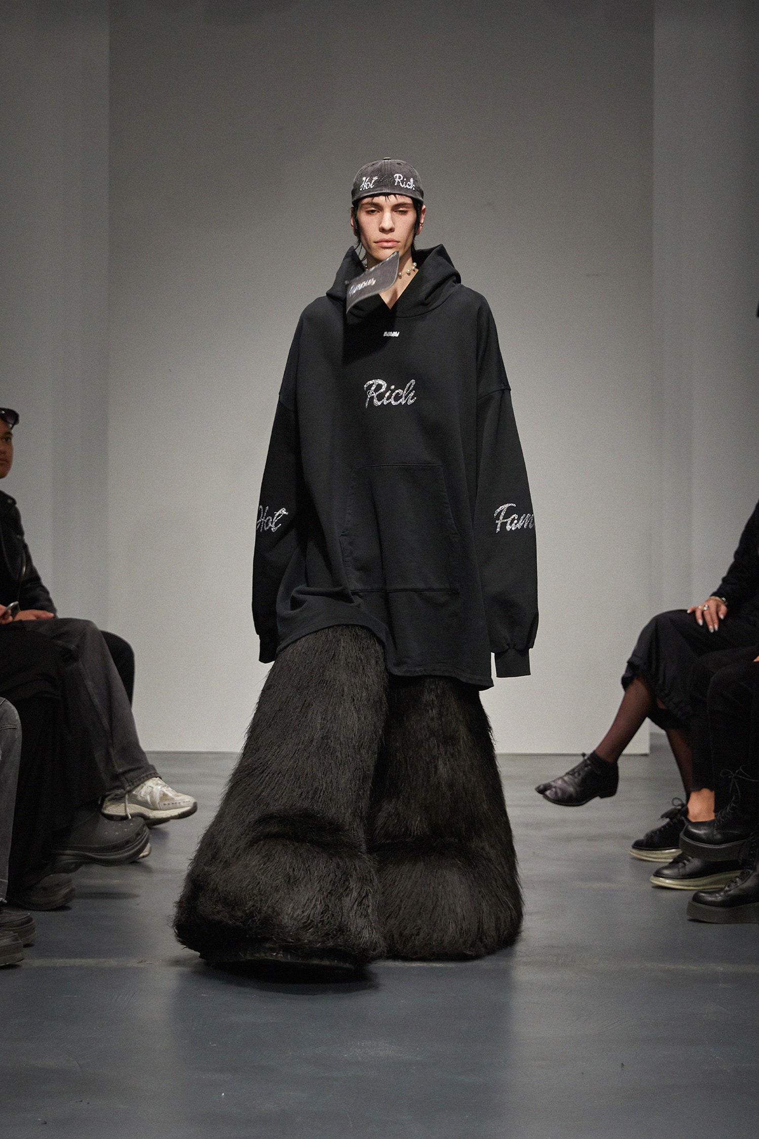 black oversized hoodie and faux-fur pants